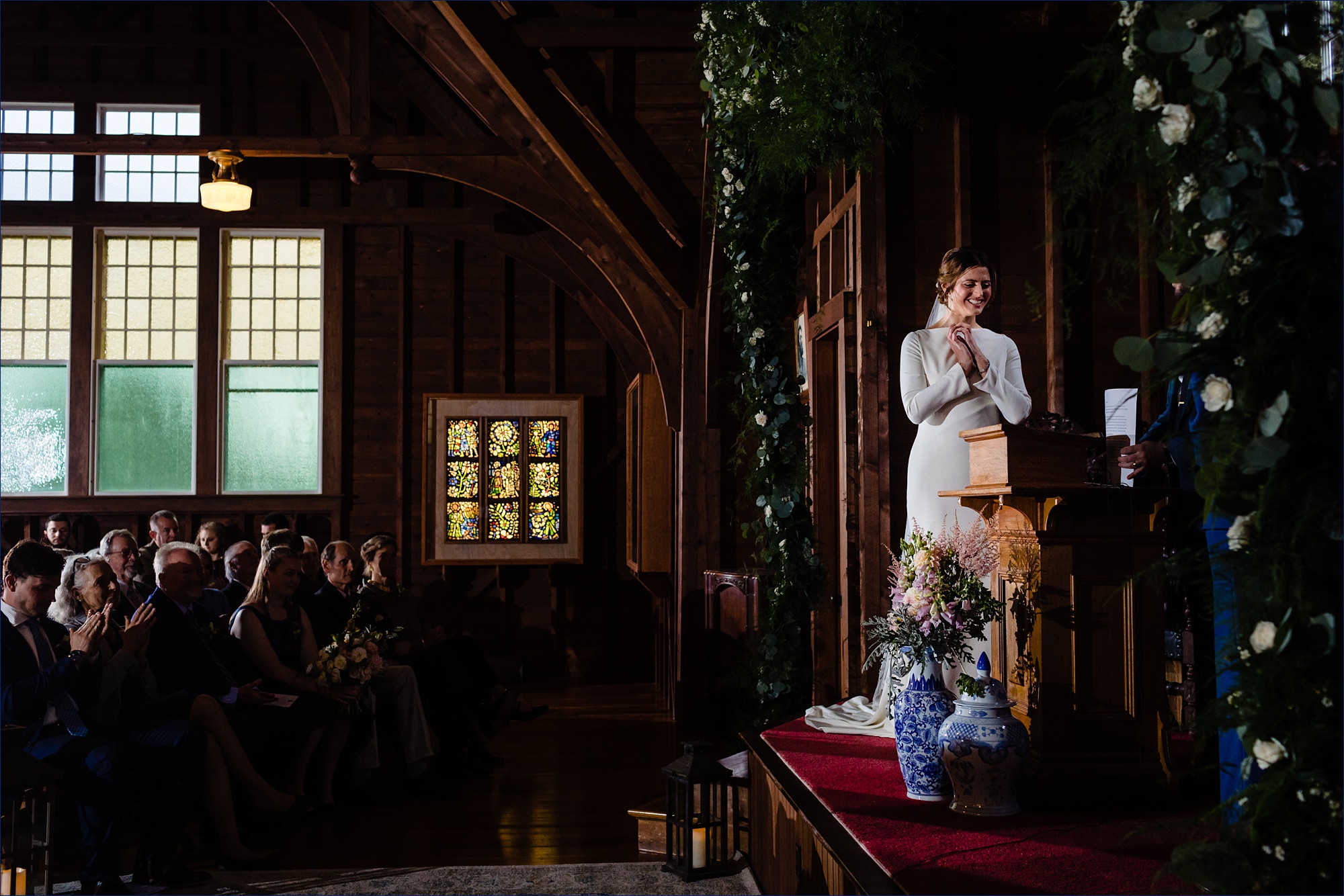The bride laughs during the wedding ceremony at Islesford Congregational Church Maine