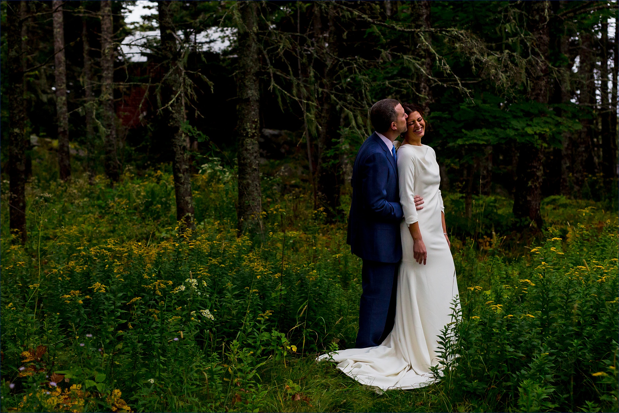 The bride and groom hold each other close before the rain starts on Little Cranberry Island Maine for their wedding