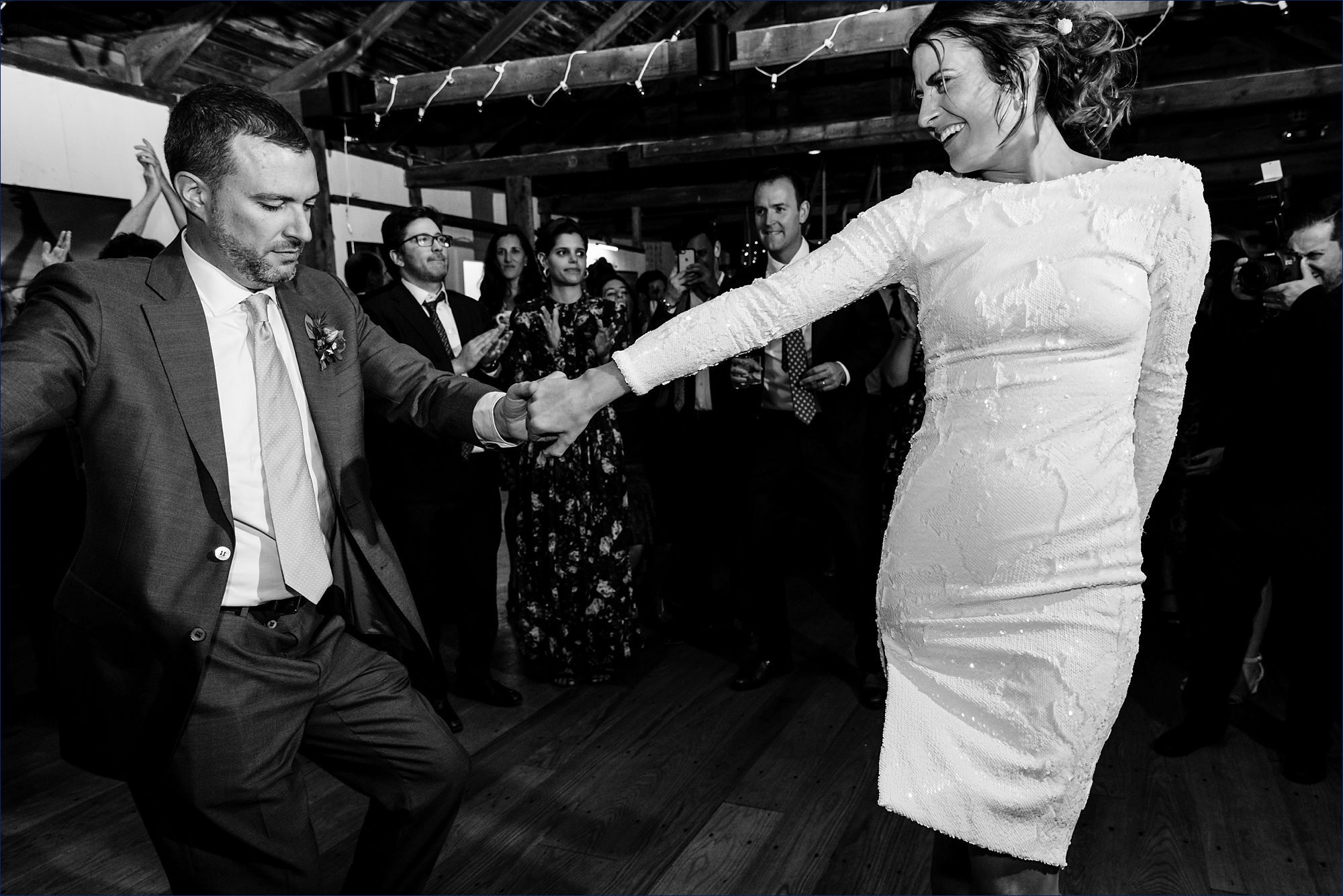 The bride and groom make it official on the dance floor at their Maine wedding reception 