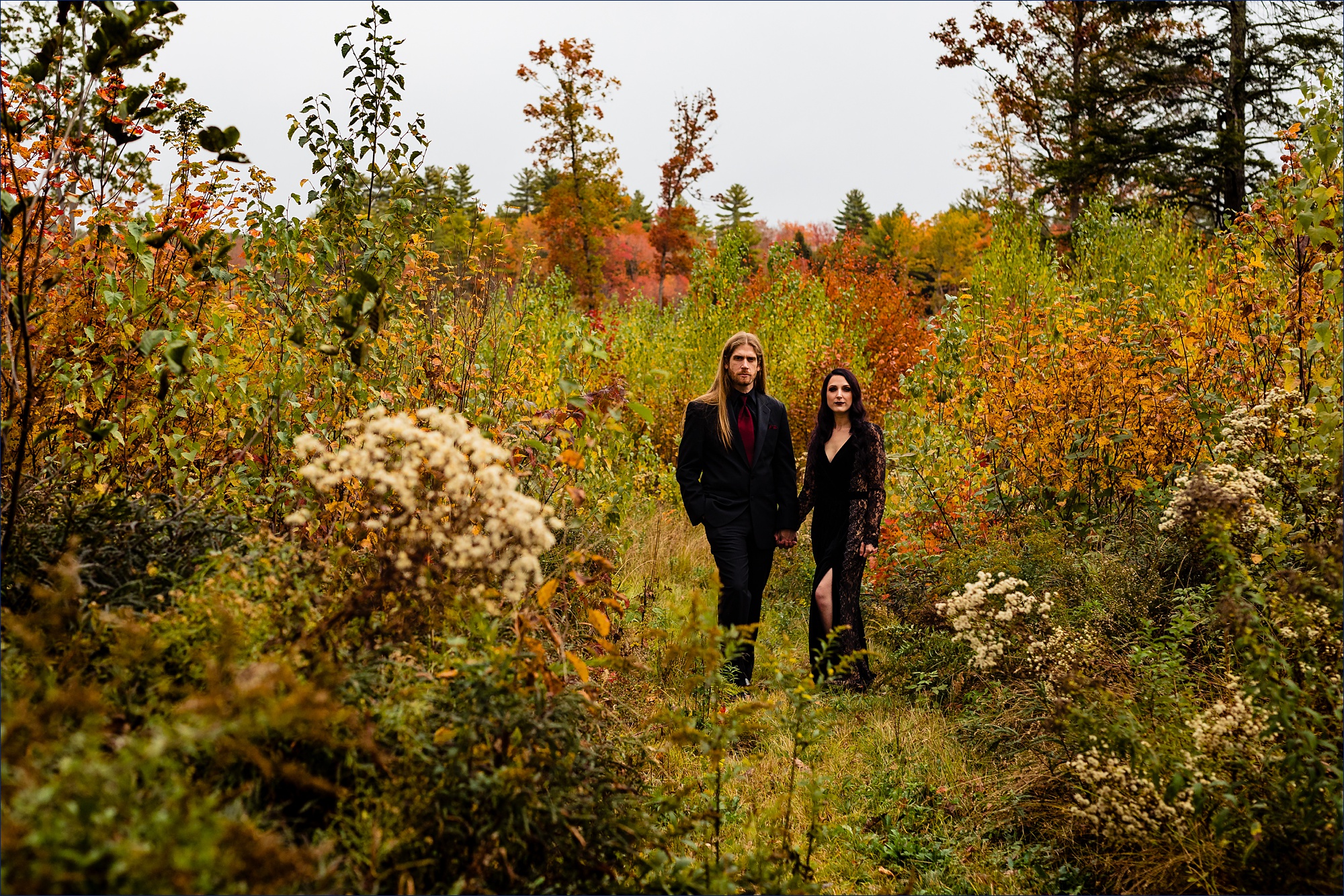 The stunning bride and groom on their Halloween inspired New Hampshire wedding day in fall