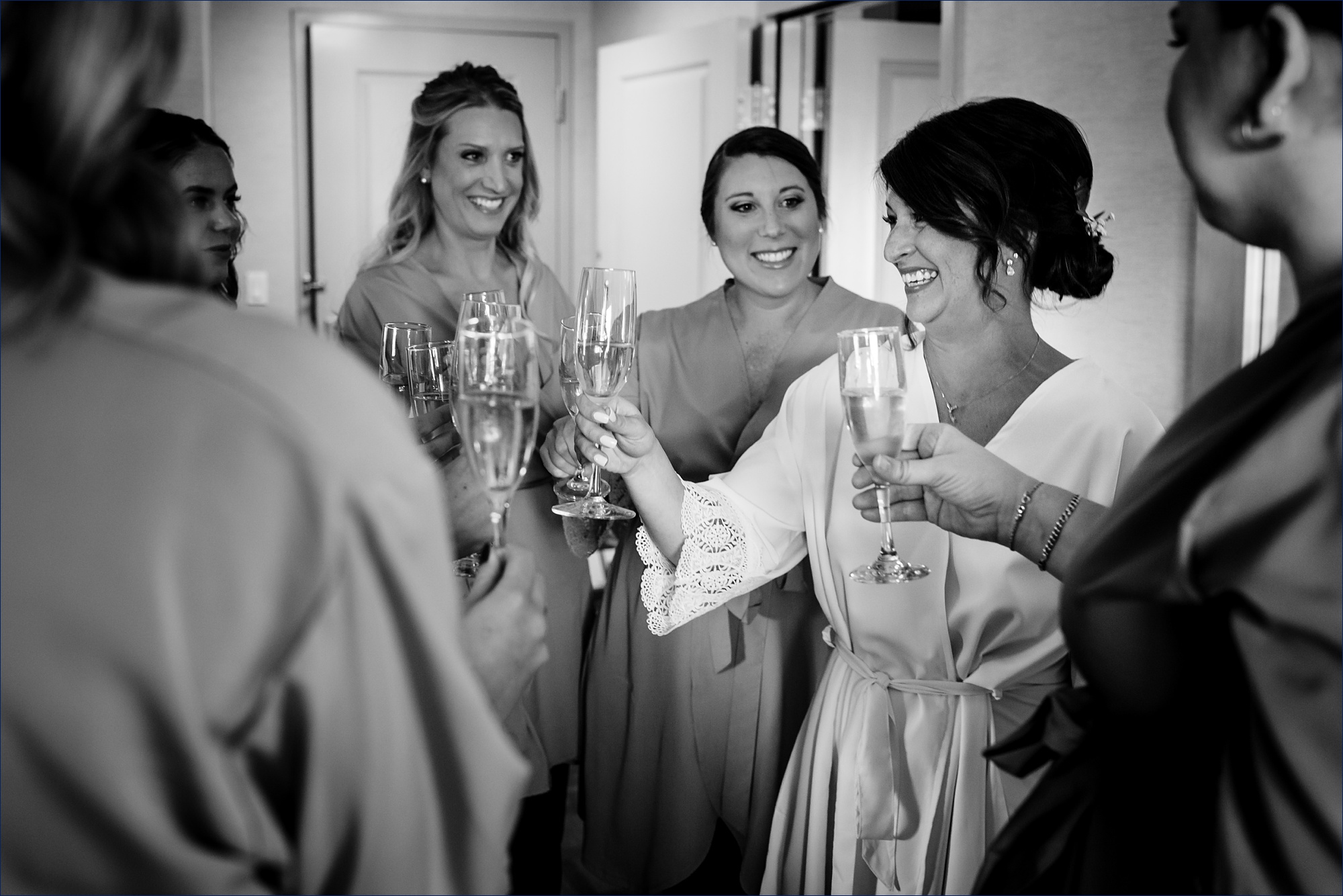 THe bride and her best friends all toast to her wedding day in New Hampshire