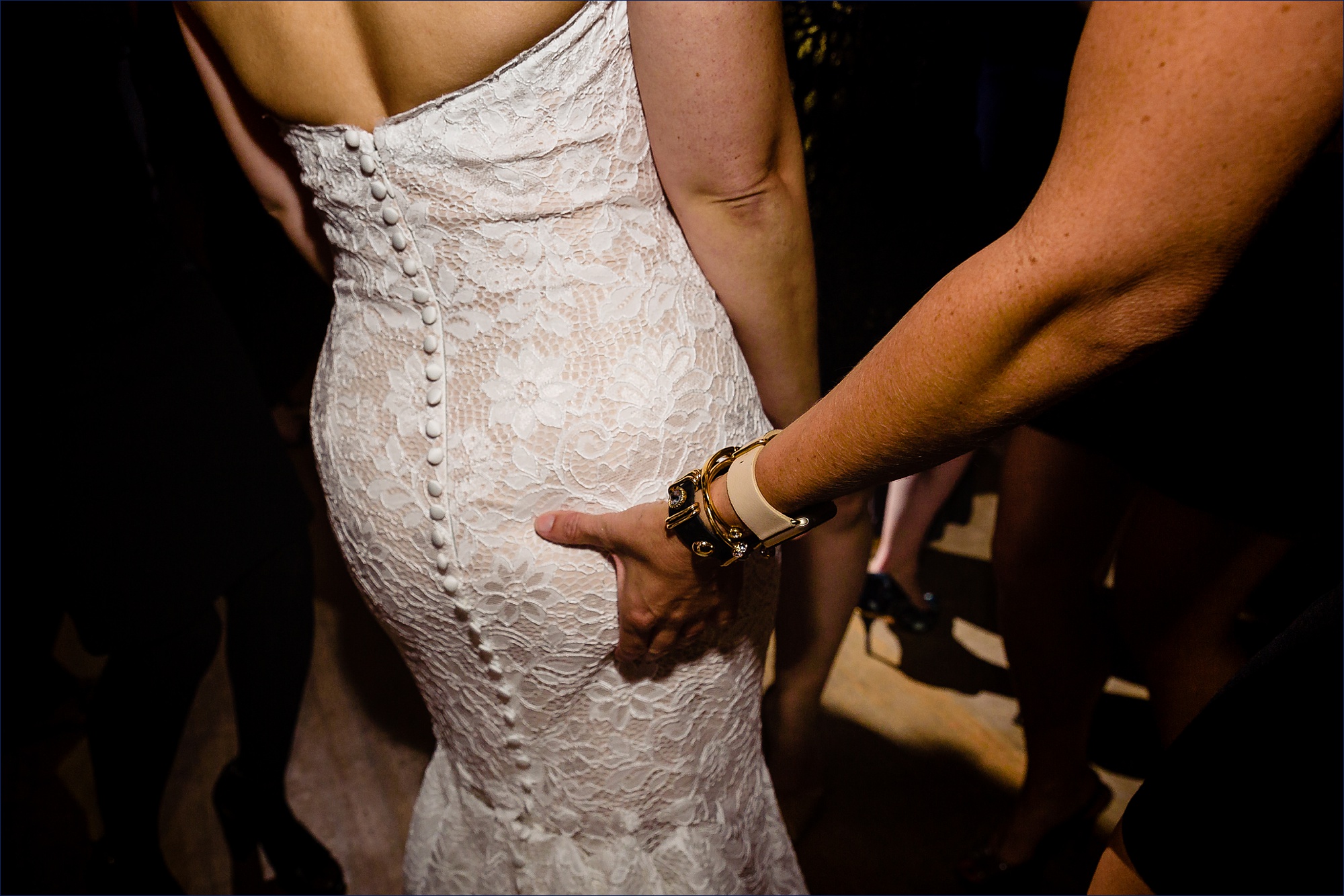 Butt squeeze for the bride at her wedding reception
