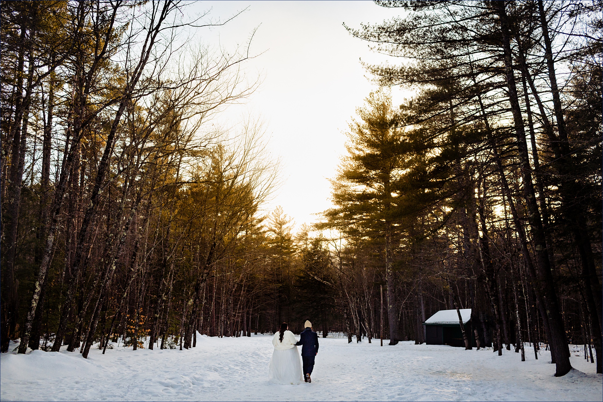 The bride and groom head to Echo Lake State Park New Hampshire for their winter elopement