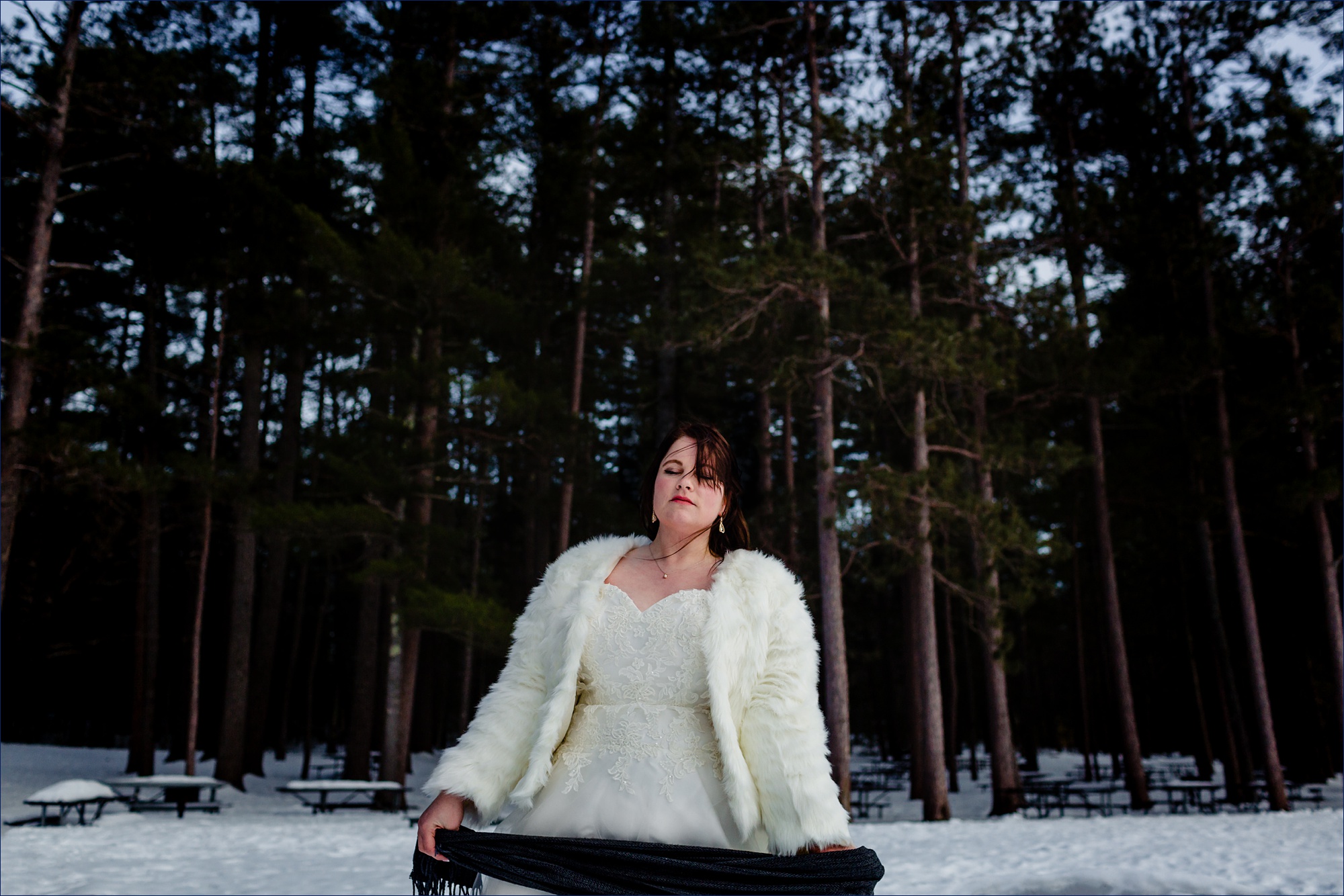 The bride on her NH elopement day in the winter woods