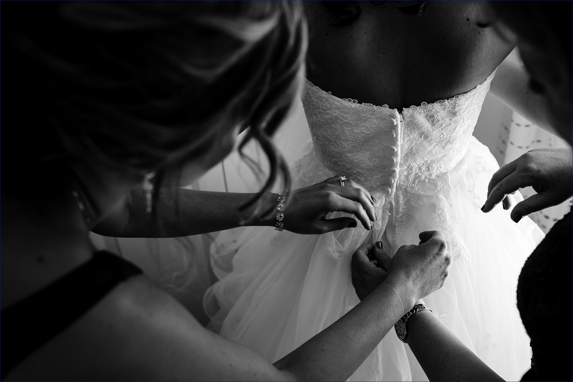 Getting the bride in her wedding day dress