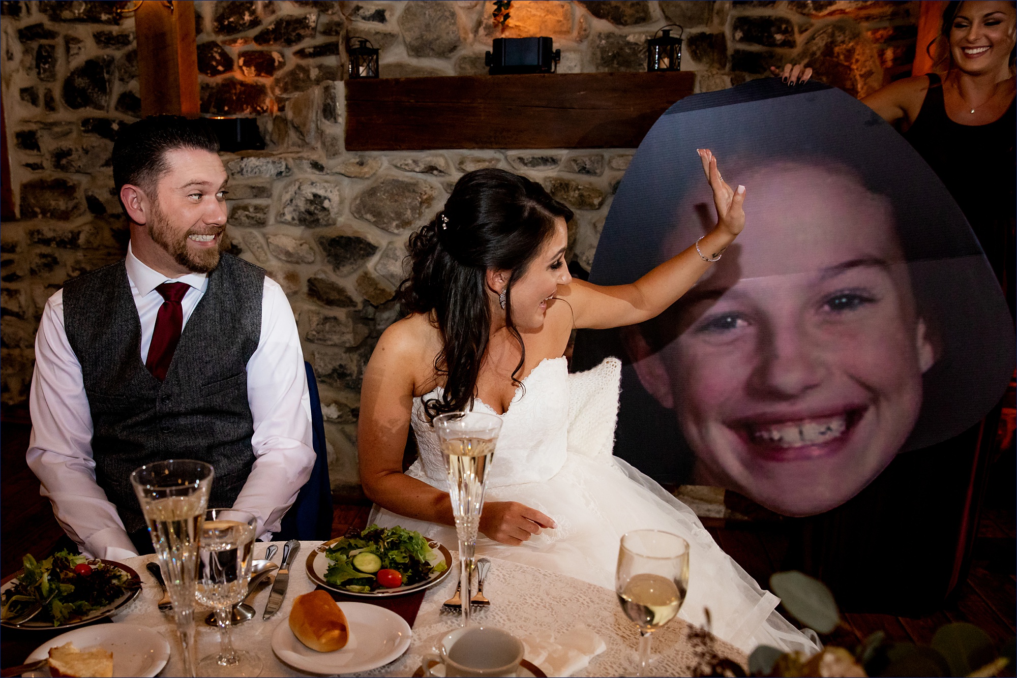 An embarrassing photo of the bride at the wedding reception creates a reaction