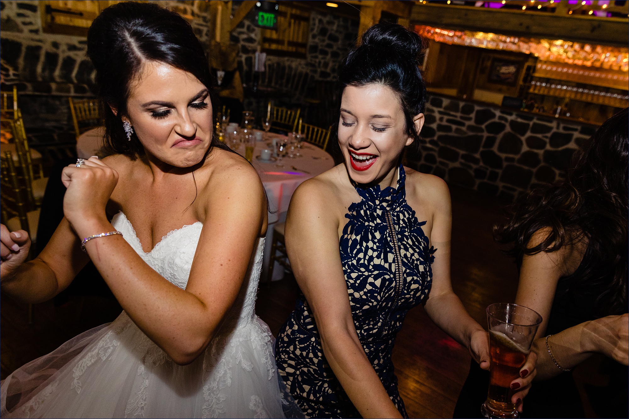 The bride dances with friends on her wedding day