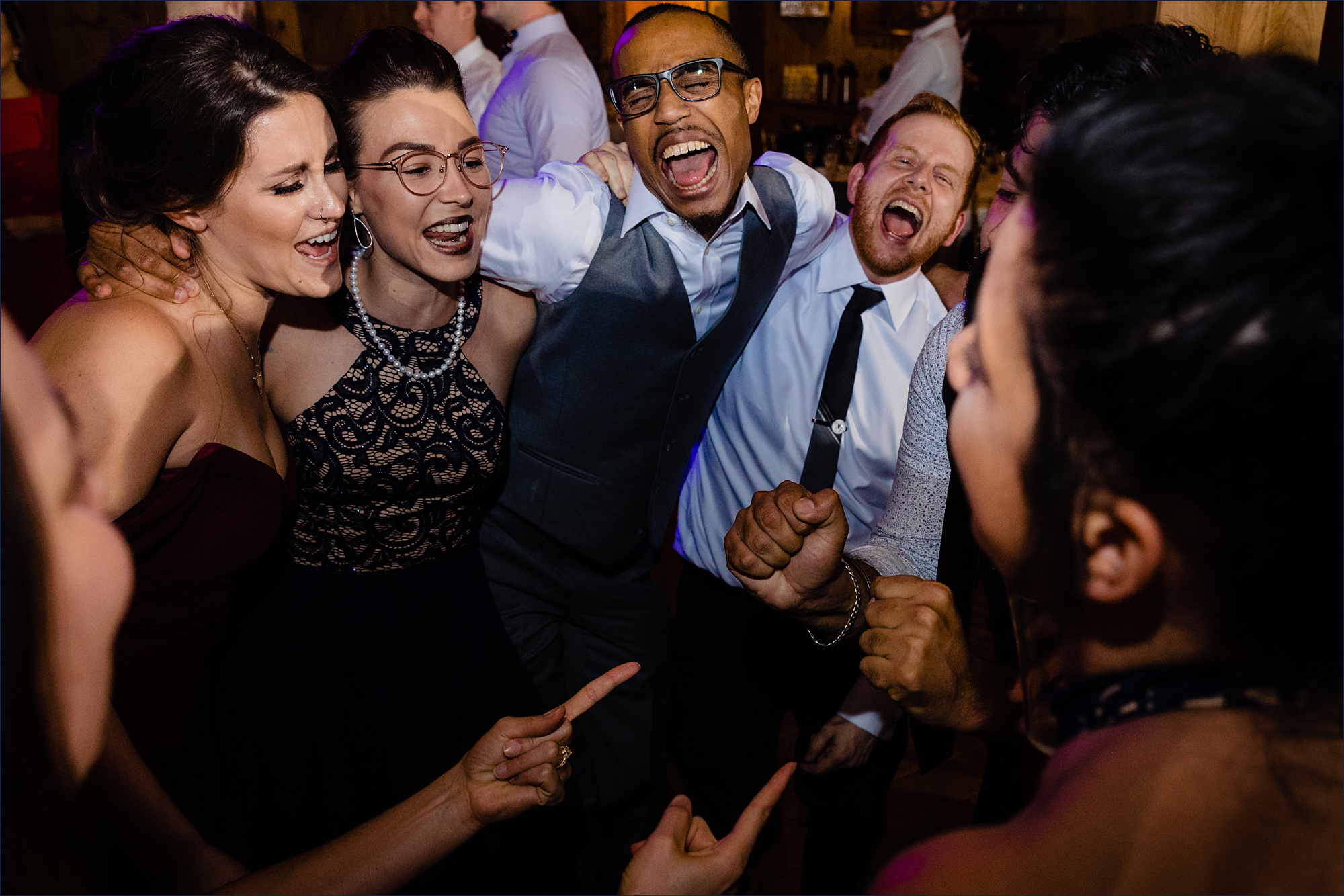 The crowd gets into the music on the dance floor of the wedding