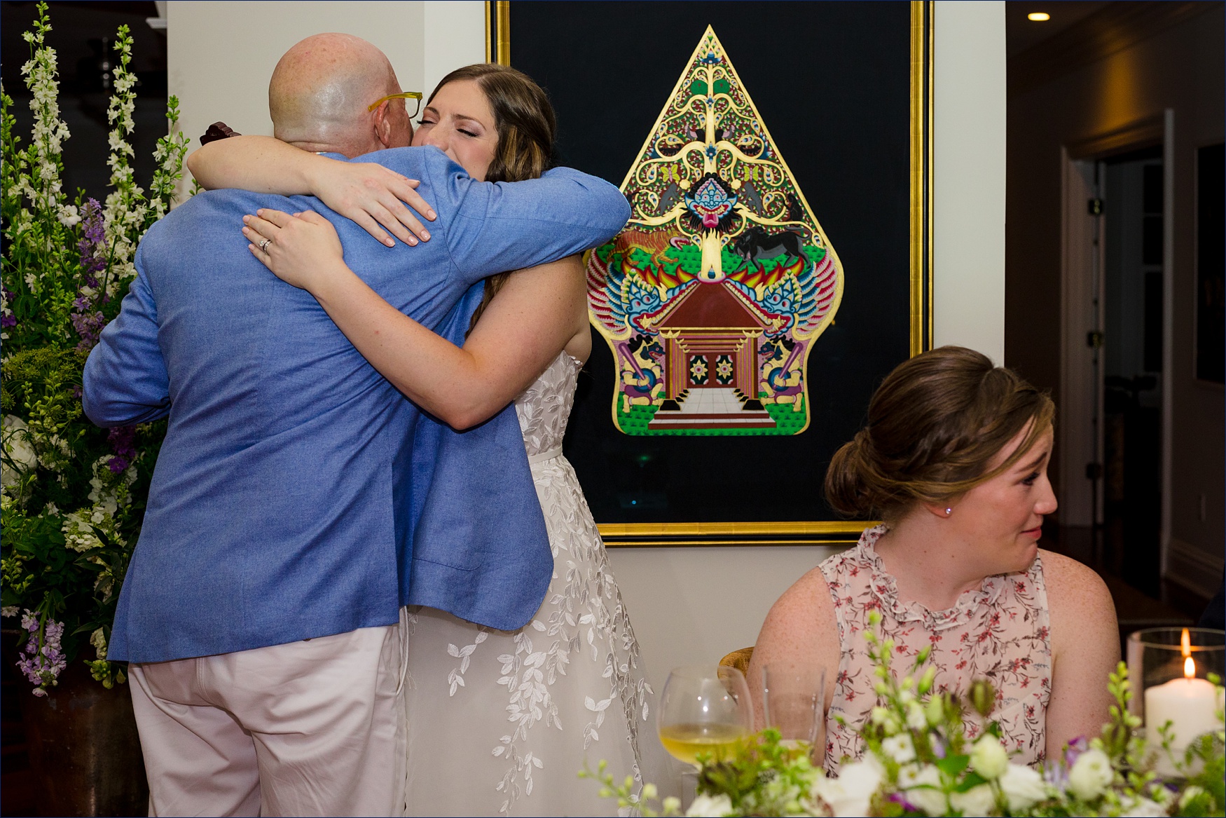 The bride tearfully hugs her father after his song