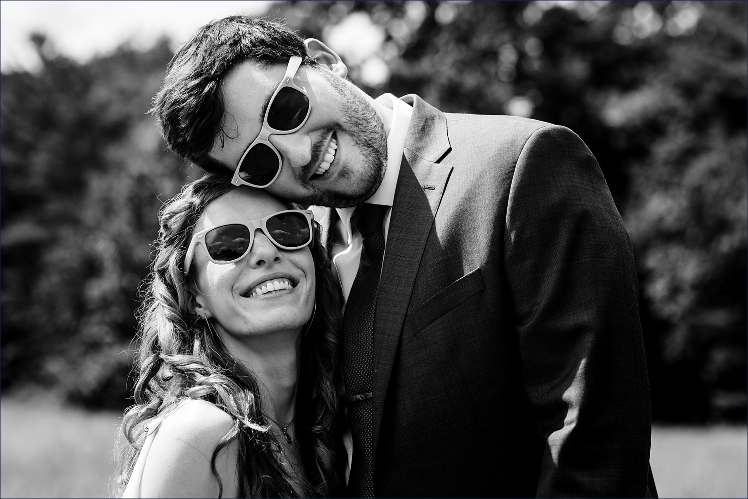 Sunglasses on the hot bright wedding day in Andover, MA for the couple