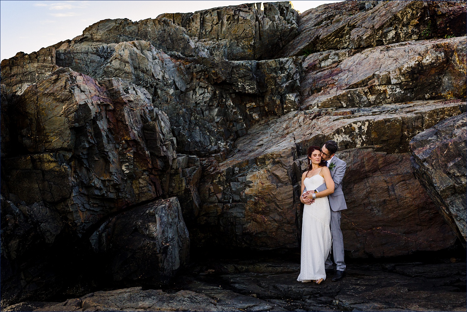 Huddling in the shade of the giant rock walls in Ogunquit beach Maine after eloping