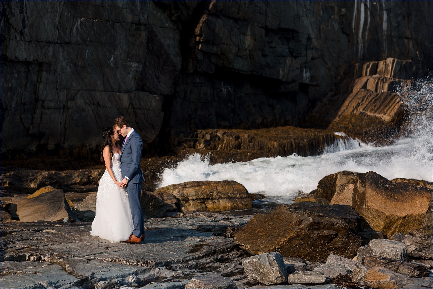 Nose to nose with the sea crashing around them at the Cliff House in Cape Neddick Maine on their elopement