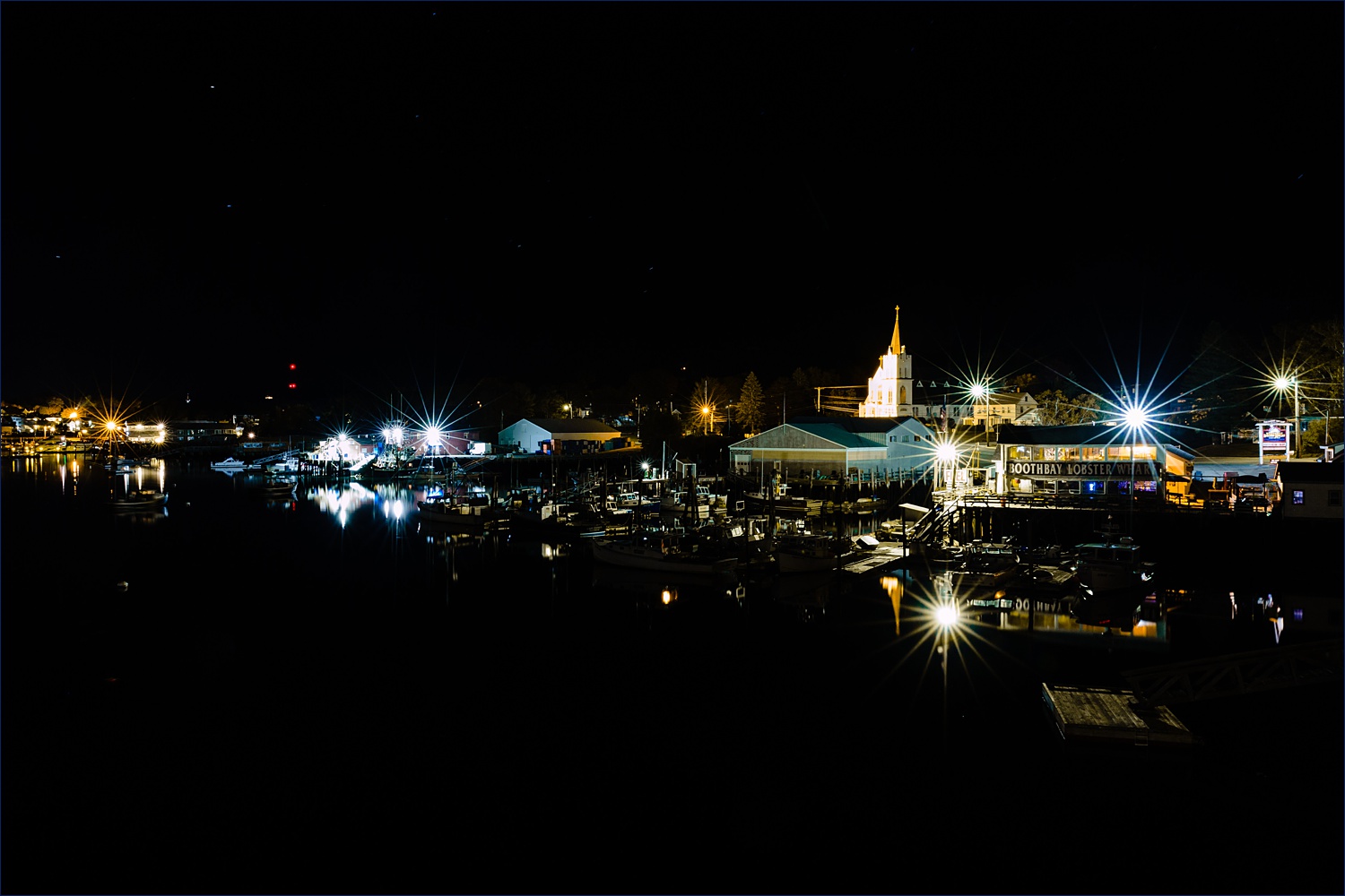 Boothbay Harbor Maine at night reflected in the waters