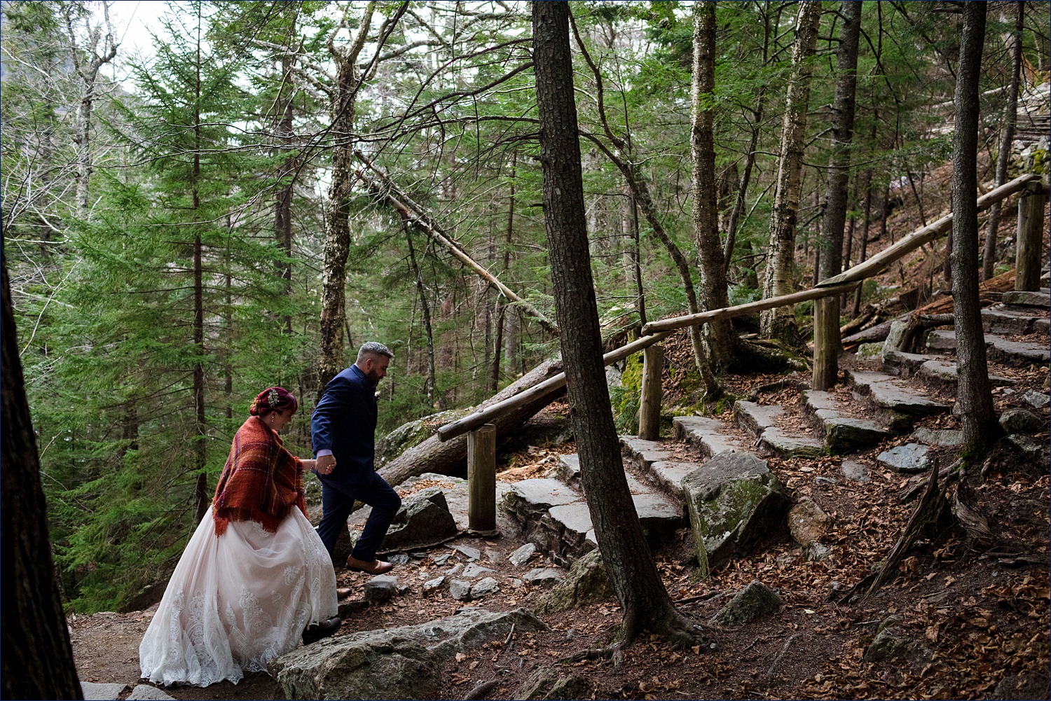 Walking up the green lined path by Glen Ellis Falls for their White Mountain Elopement