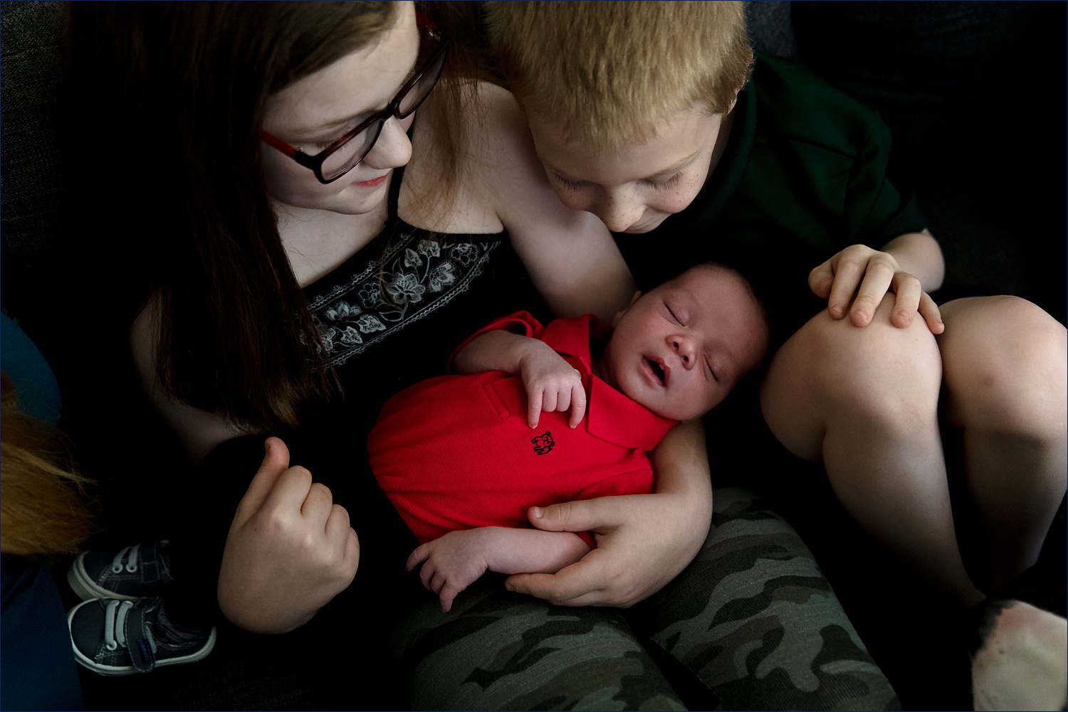 Older siblings love on their newborn brother in Seacoast New Hampshire