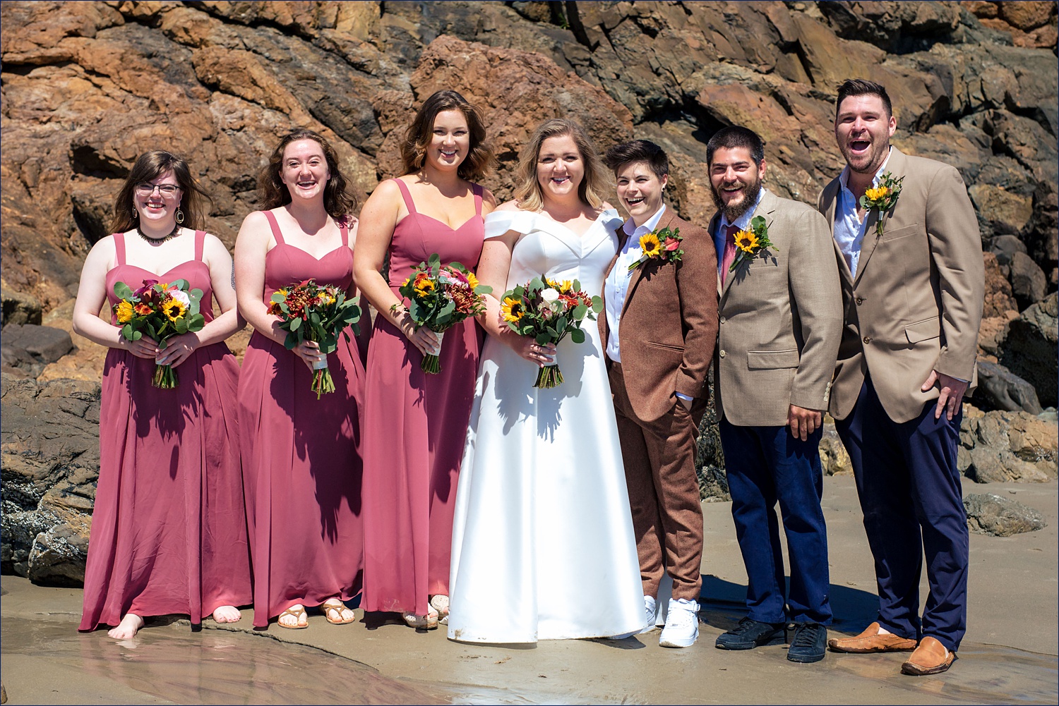 The wedding party poses for a photo on the beaches of Ogunquit Maine