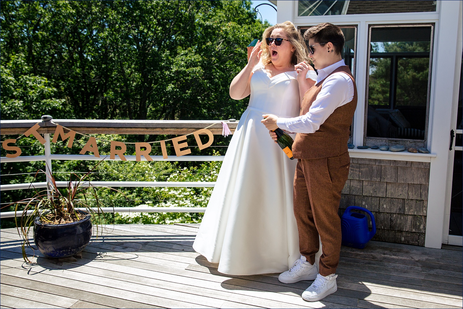 Popping the champagne to mark being Just Married in Maine