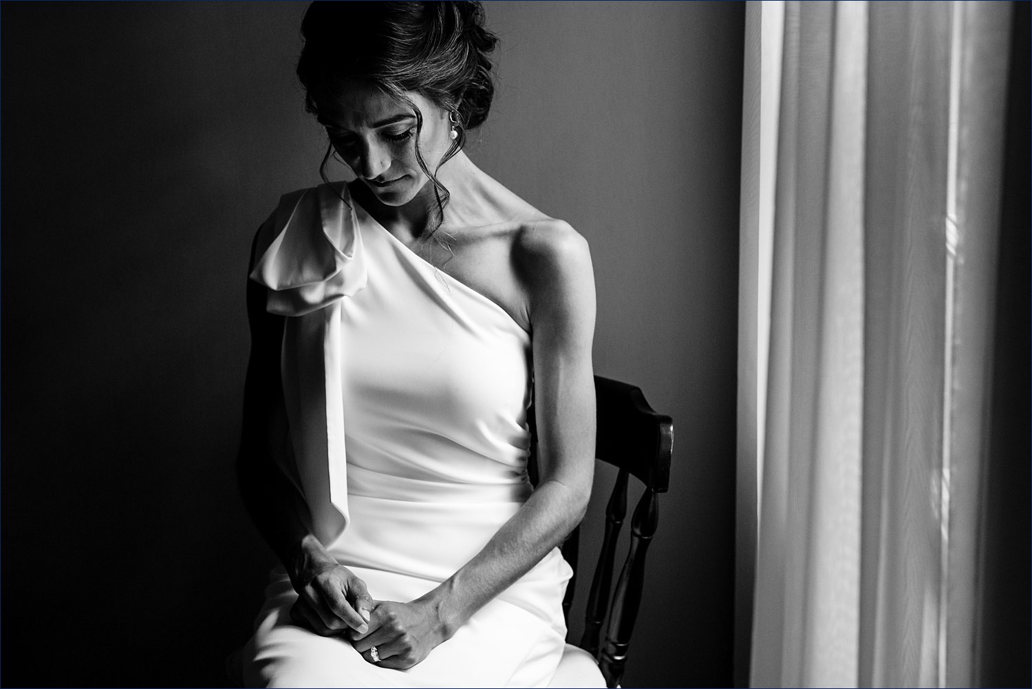 A bridal portrait in her room before the first look begins at their Dockside Guest Quarters wedding day in Maine