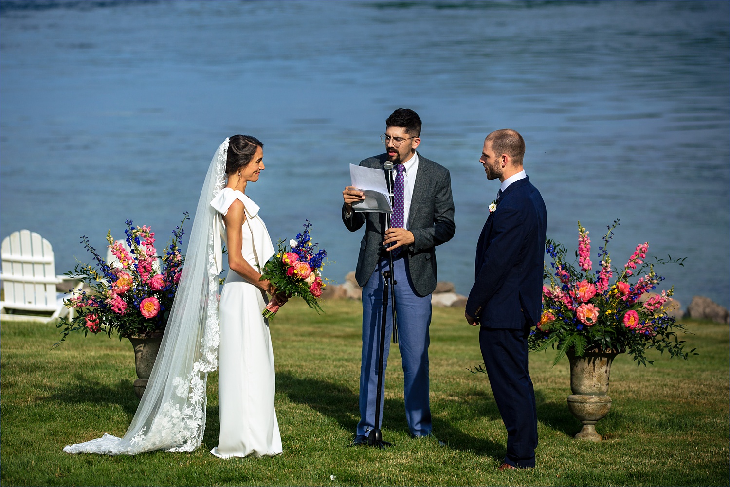The couple and their friend the officiant during their outdoor southern Maine wedding ceremony