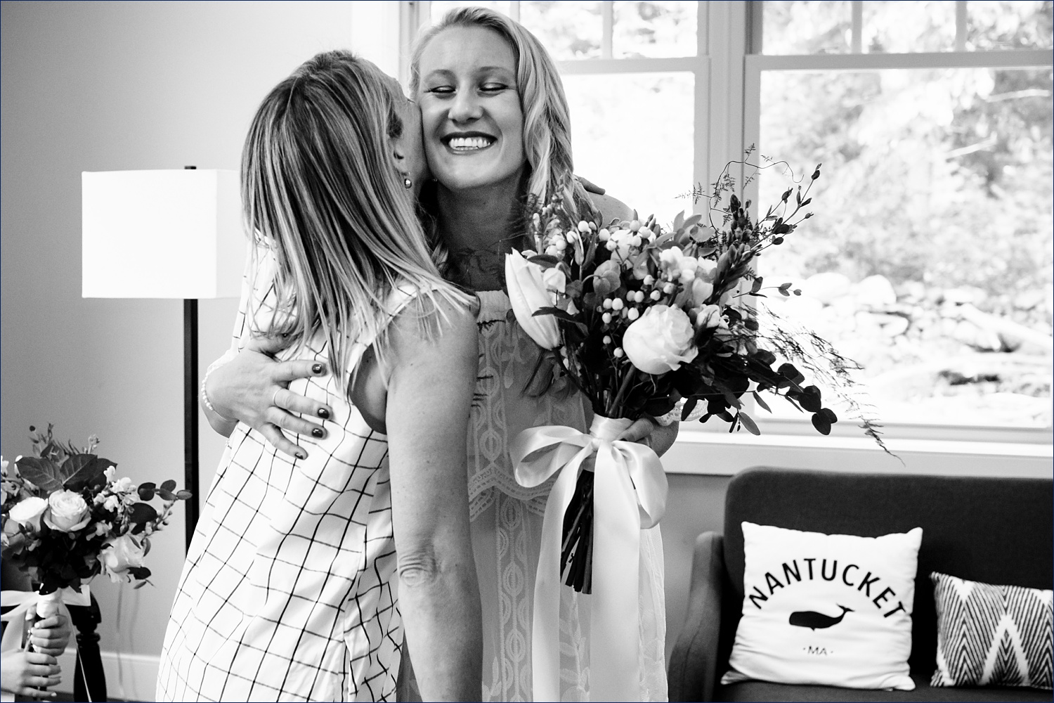 A hug from a friend on the wedding day for the bride