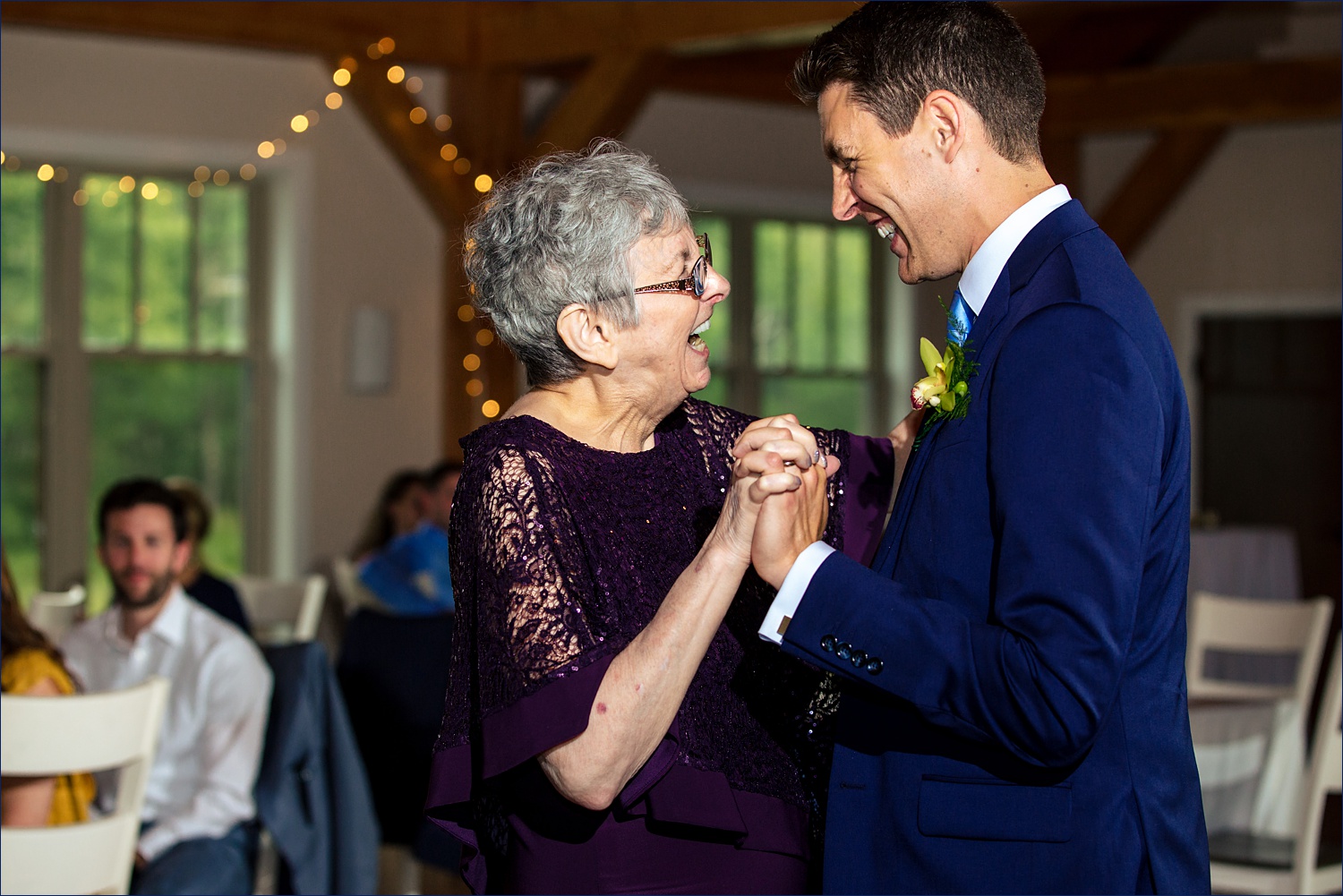 The groom dances with his mom at his NH wedding reception