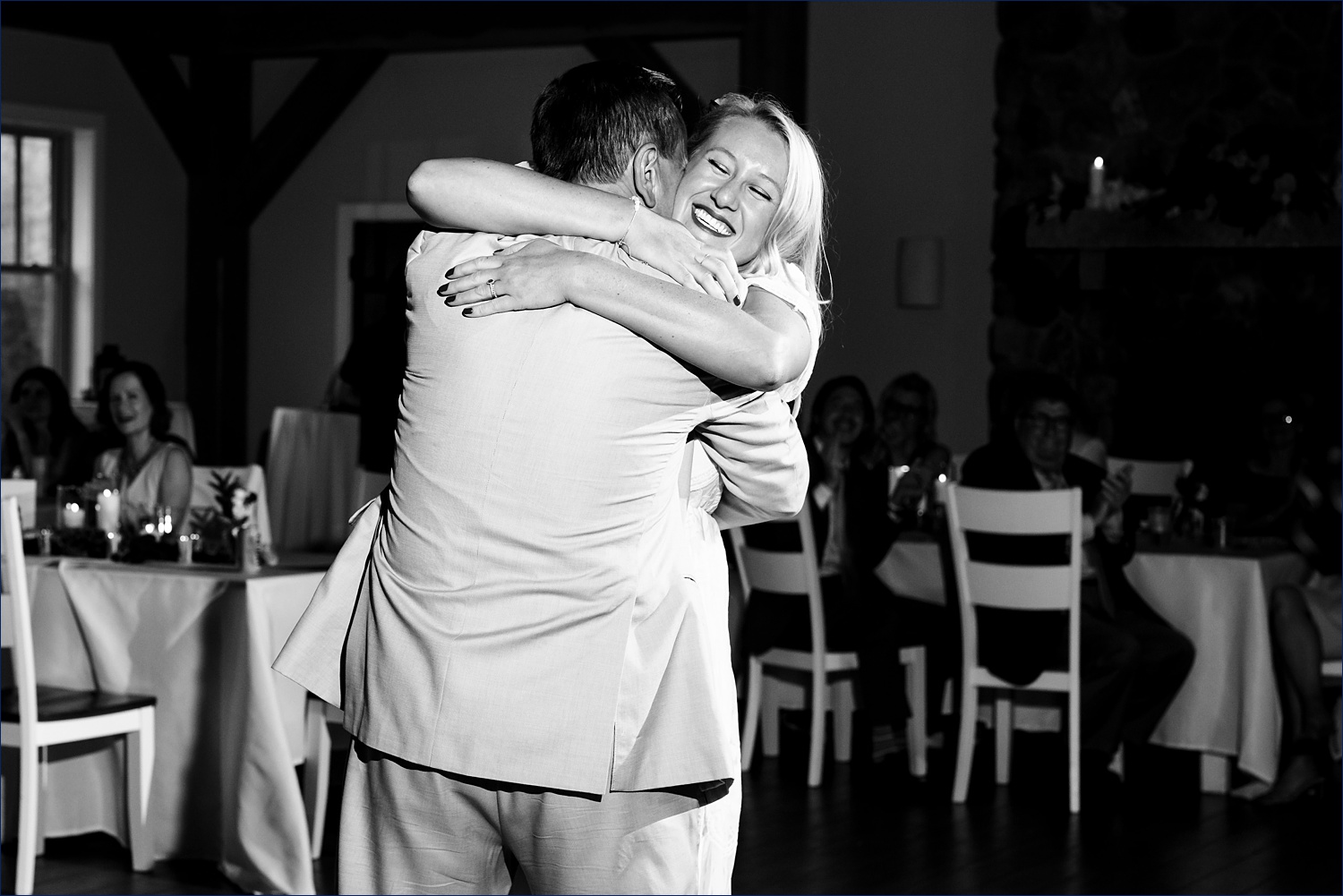 The bride embraces her dad during the wedding reception