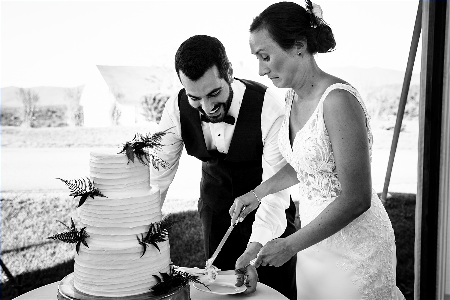 More laughter and faces during the cake cutting at the White Mountains NH wedding day
