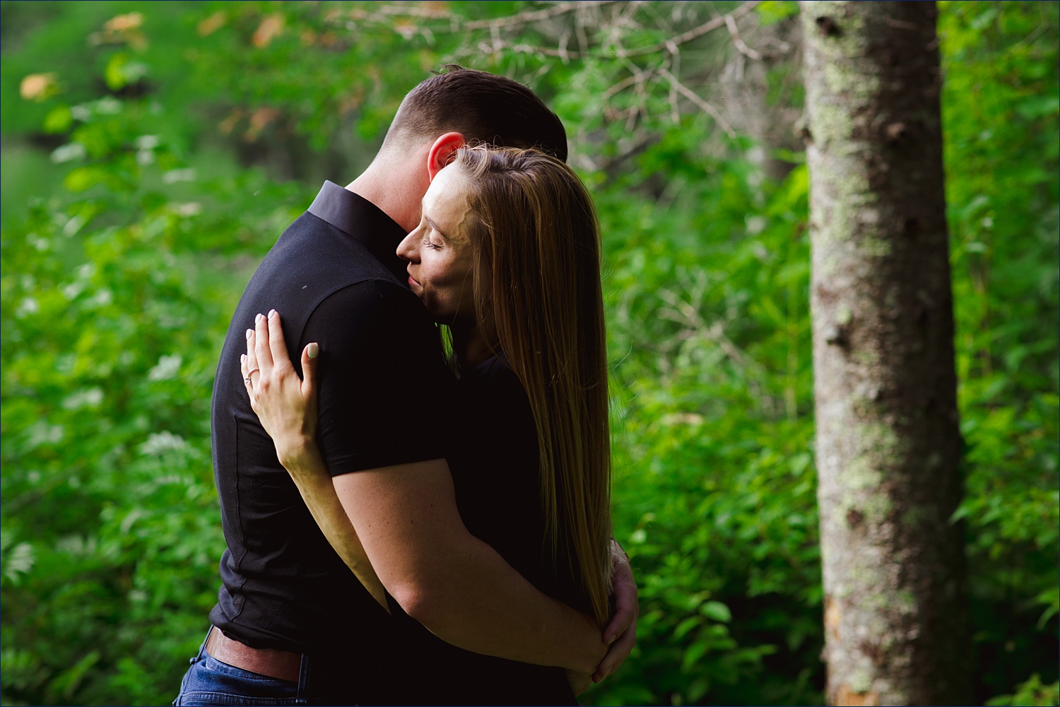 Warm embrace of the couple in New Hampshire engagement session