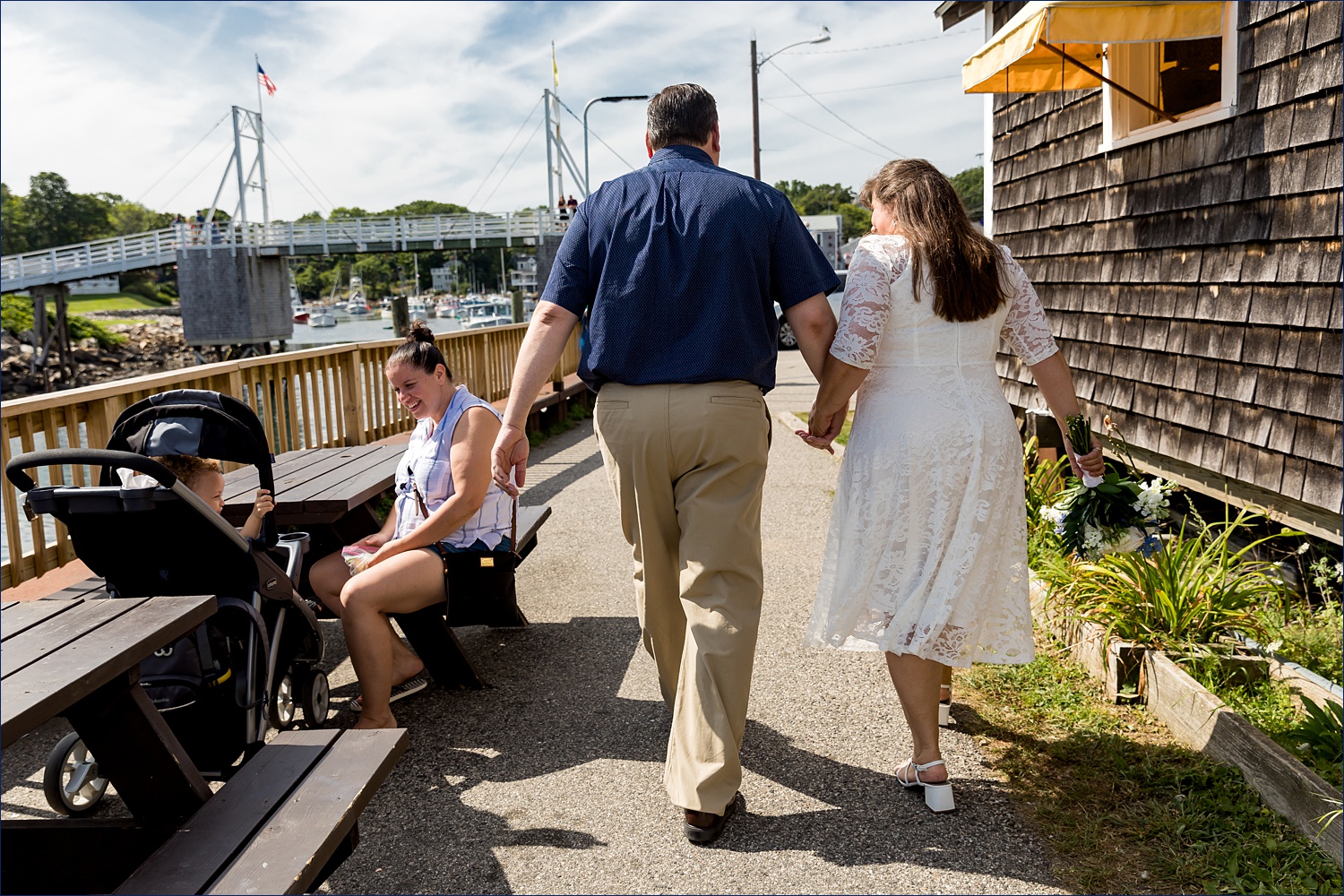 The couple talks to people who congratulate them as they head to get married in Maine 