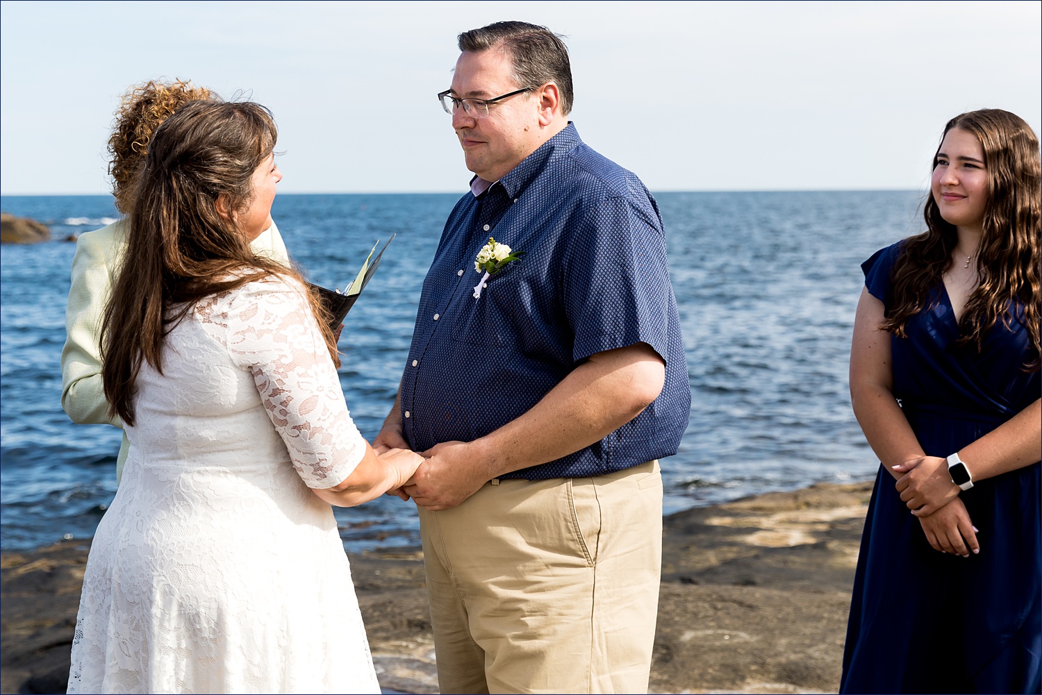 Saying their vows in front of the water in York Maine