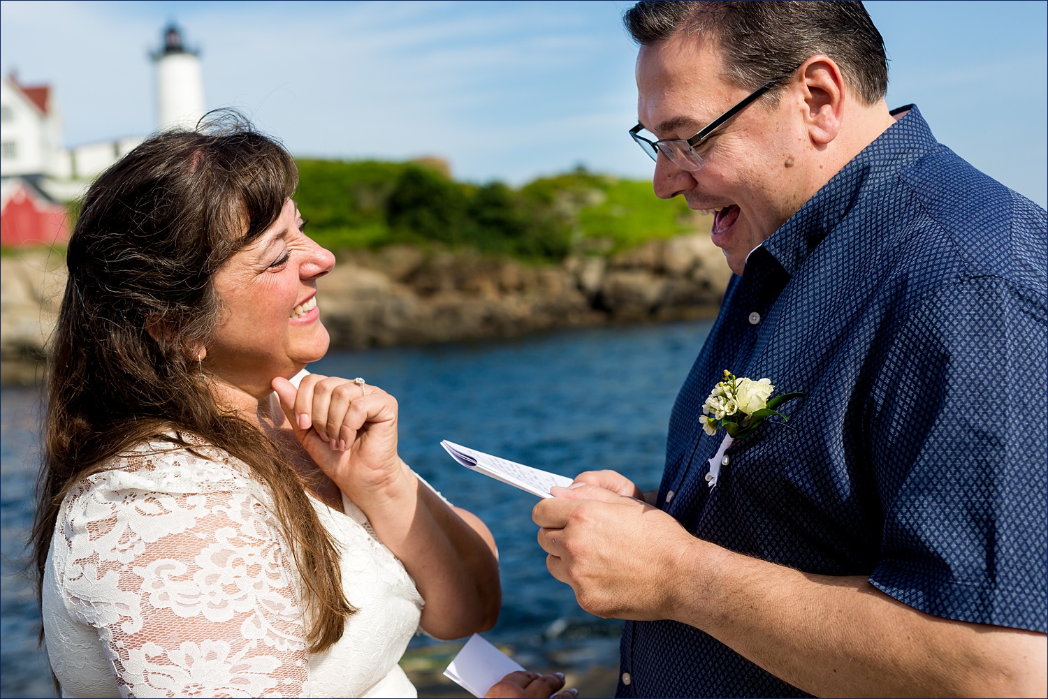 Laughing during their vows at their southern Maine elopement on the water in York Maine