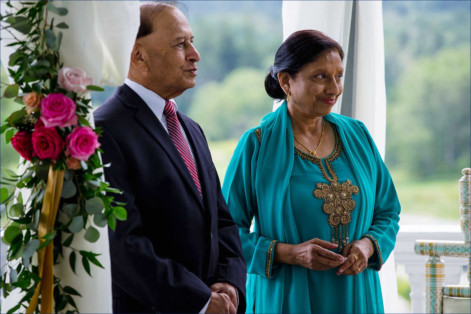 The parents of the bride at the alter of the New Hampshire Hindu wedding ceremony