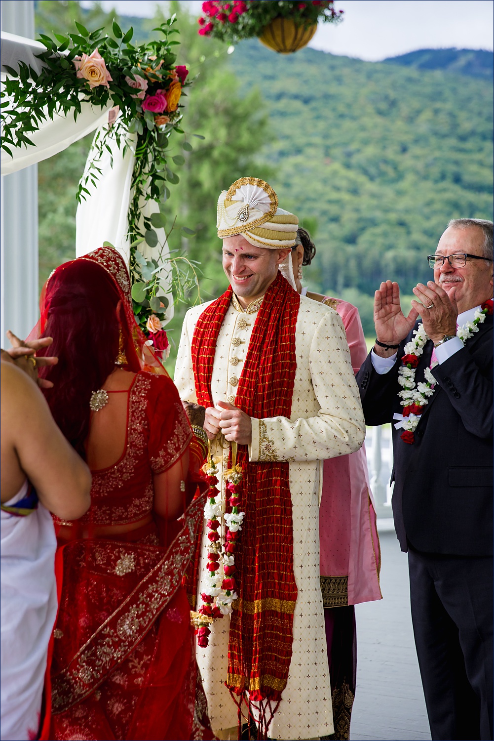 The groom marvels at the bride at the Kanya Aagaman part of the Hindu ceremony in New Hampshire on the veranda