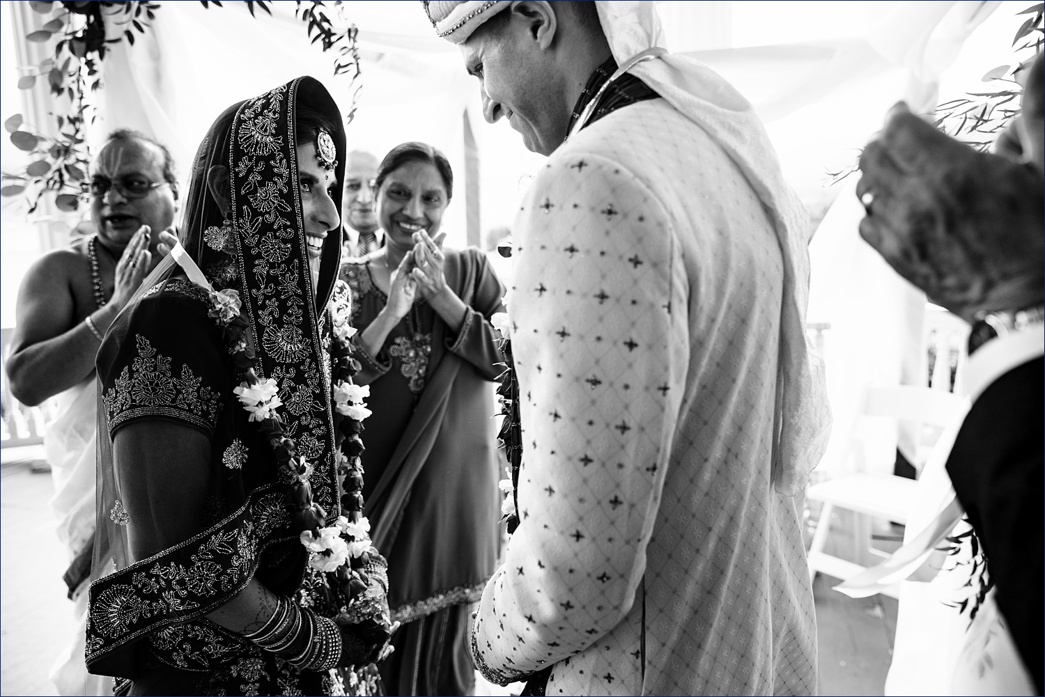 Jai Mala part of the Hindu ceremony with the bride and groom exchanging garland at the wedding ceremony in NH