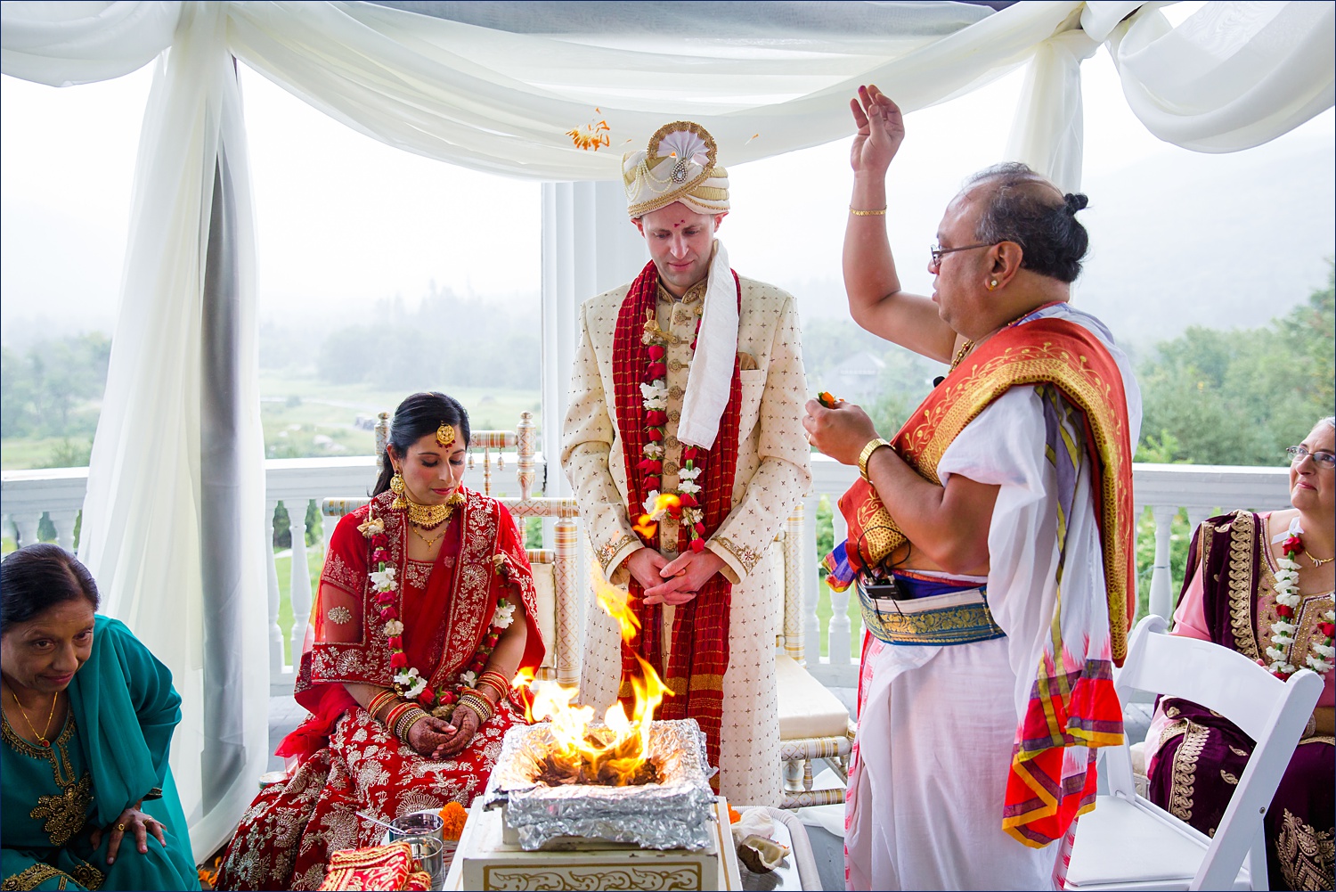 Agni Poojan and Gathbandhan and throwing marigold flowers over the couple during the Bretton Woods NH ceremony