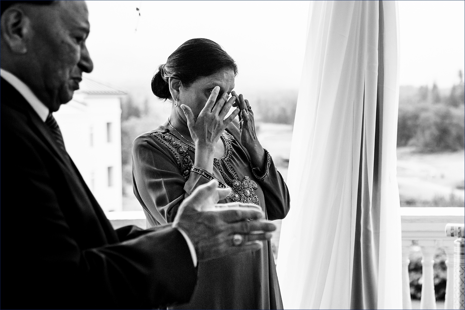 The mother of the bride wipes away tears at the wedding ceremony in NH