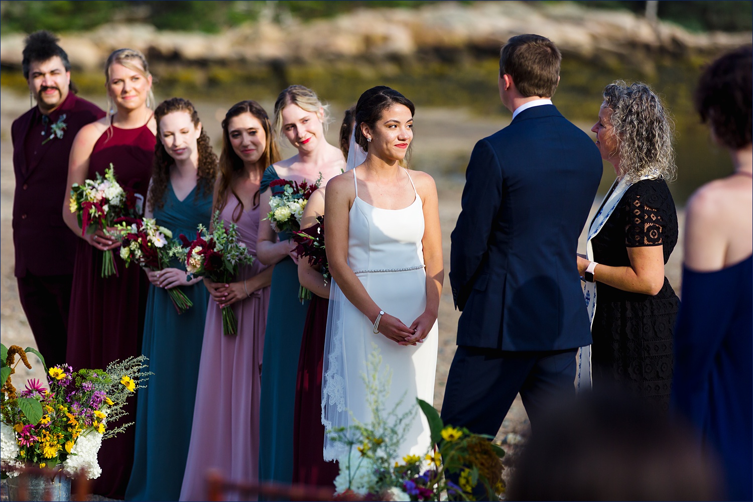 The bride and her side of the wedding party on the Maine wedding day