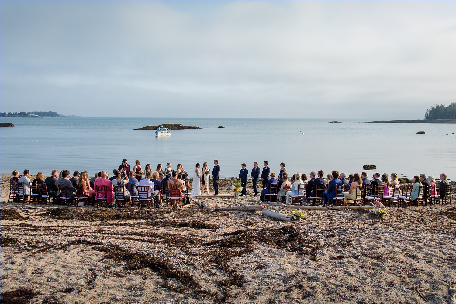 The wedding ceremony on the beach at Aragosta on Deer Isle Maine