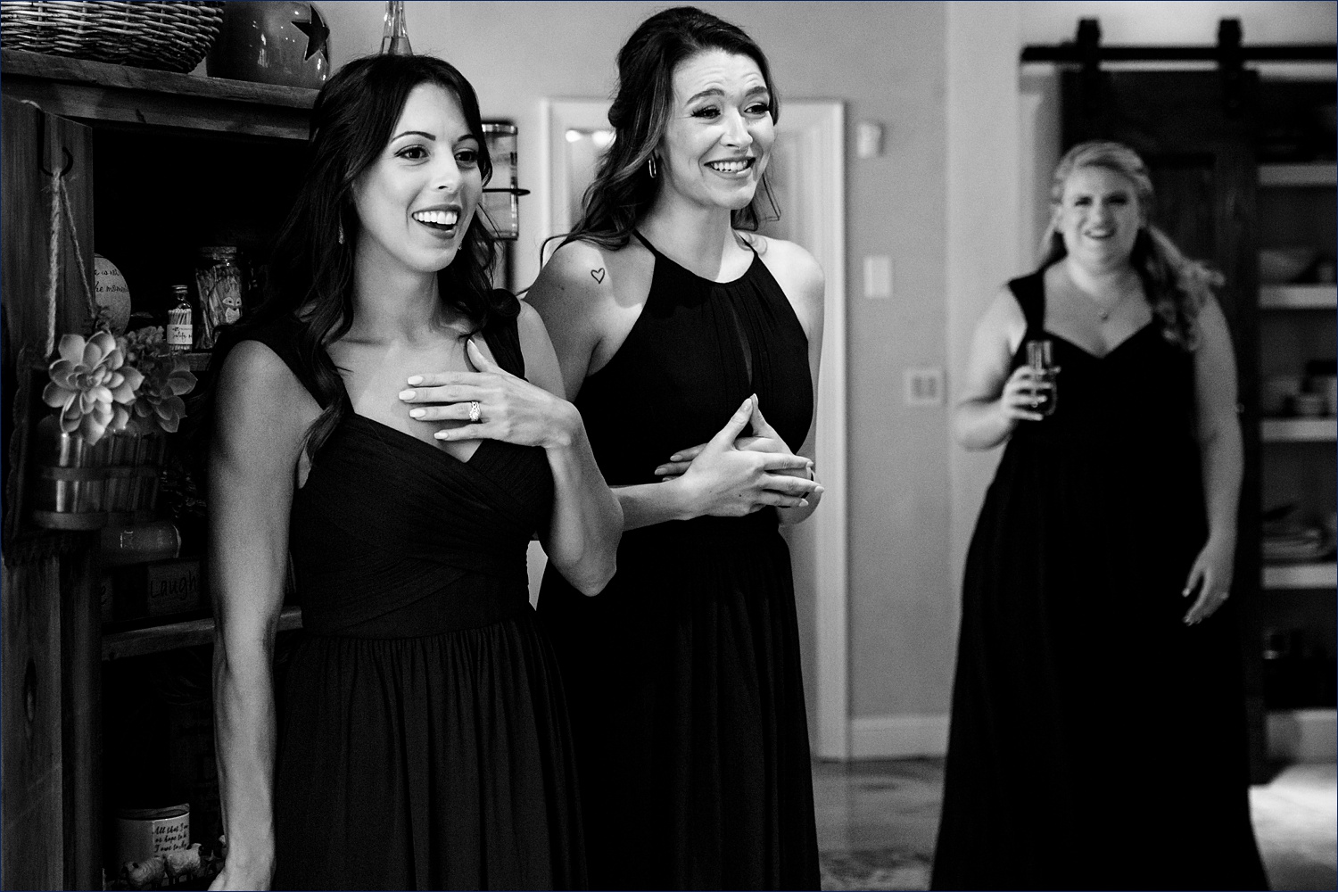 Friends react to seeing the bride in her wedding day gown
