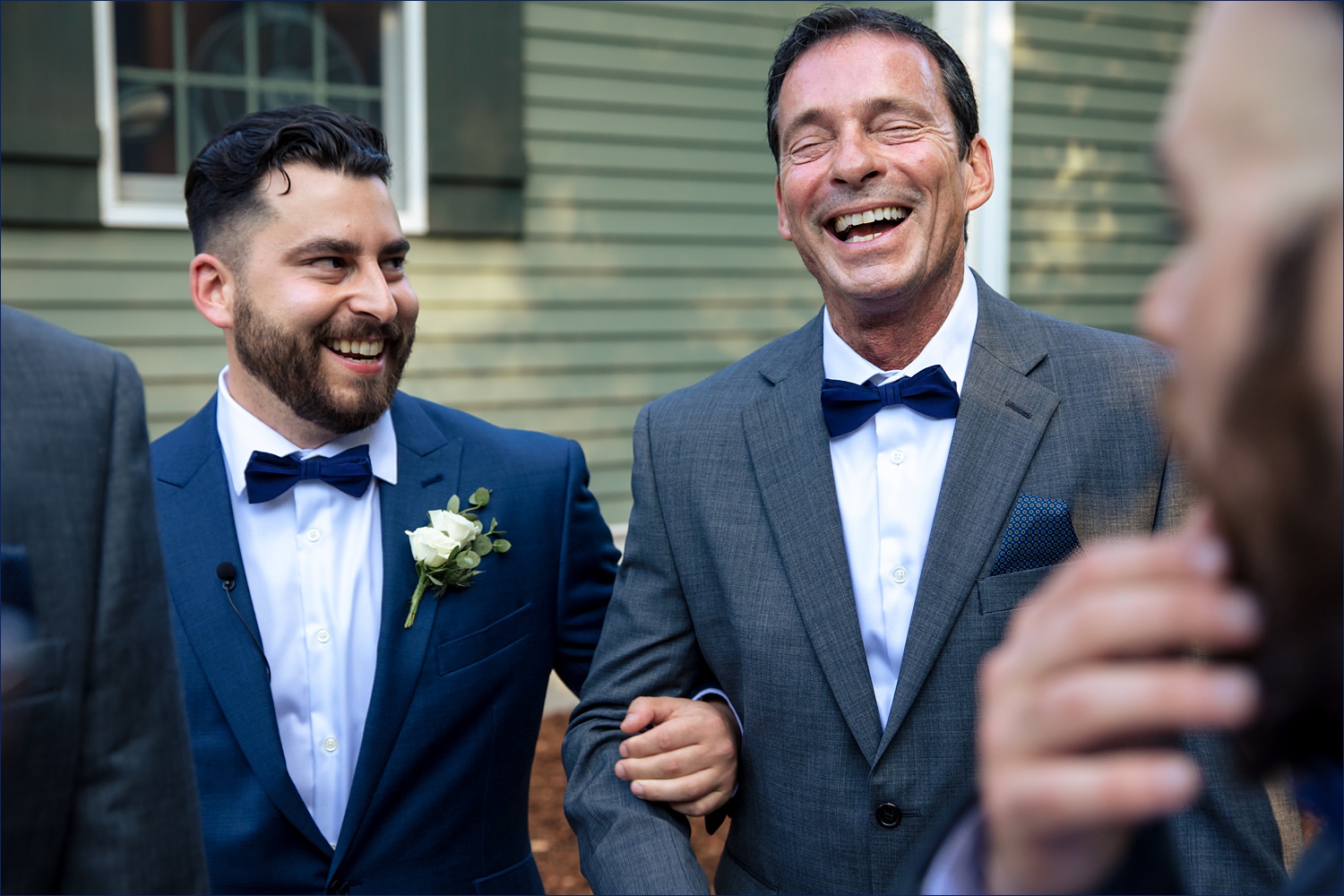 The groom and his father share a laugh