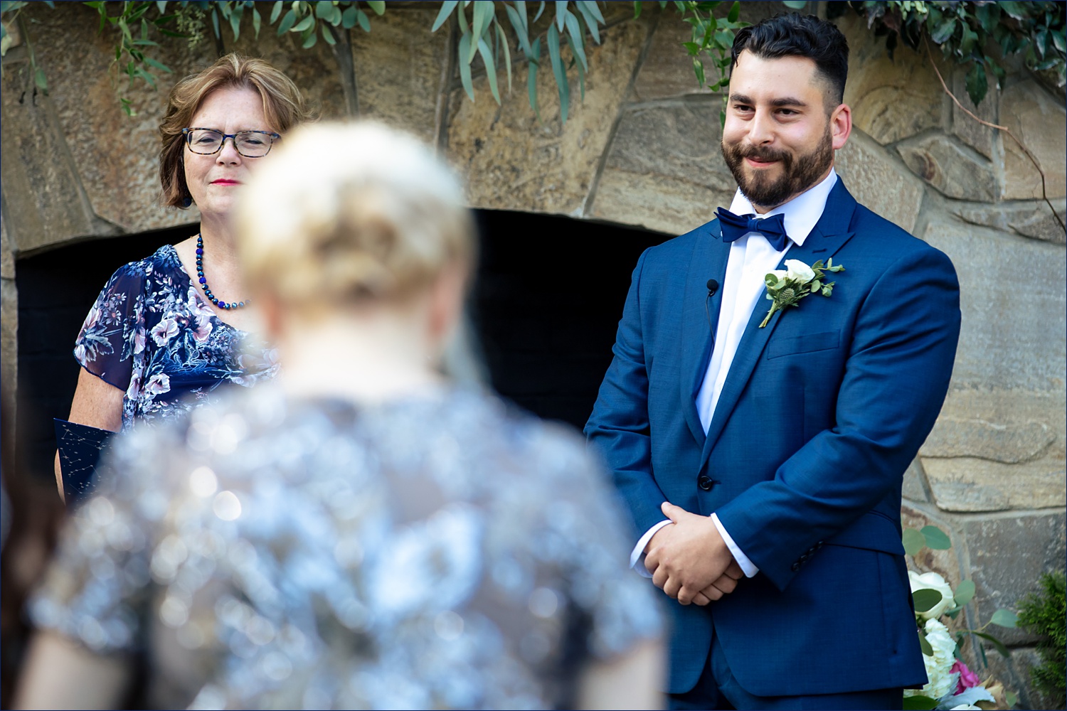 The groom sees the bride for the first time at the backyard wedding day