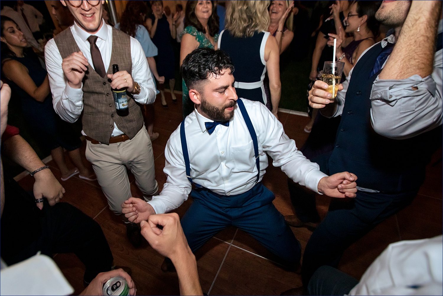 The groom parties on the dance floor 