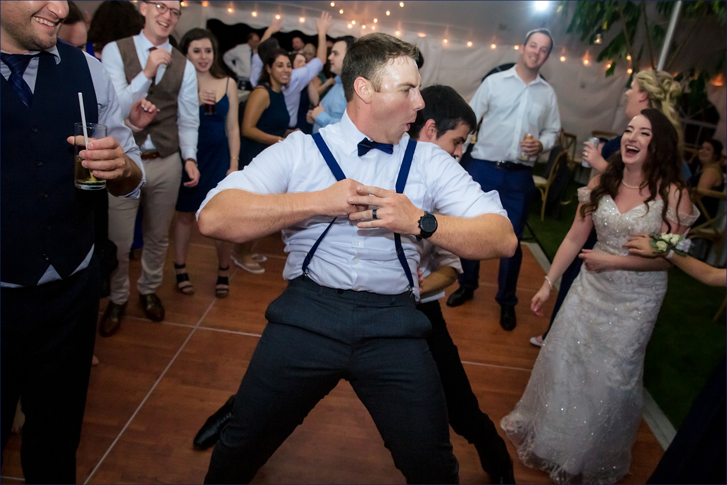 Groomsman get into the music on the New Hampshire dance floor