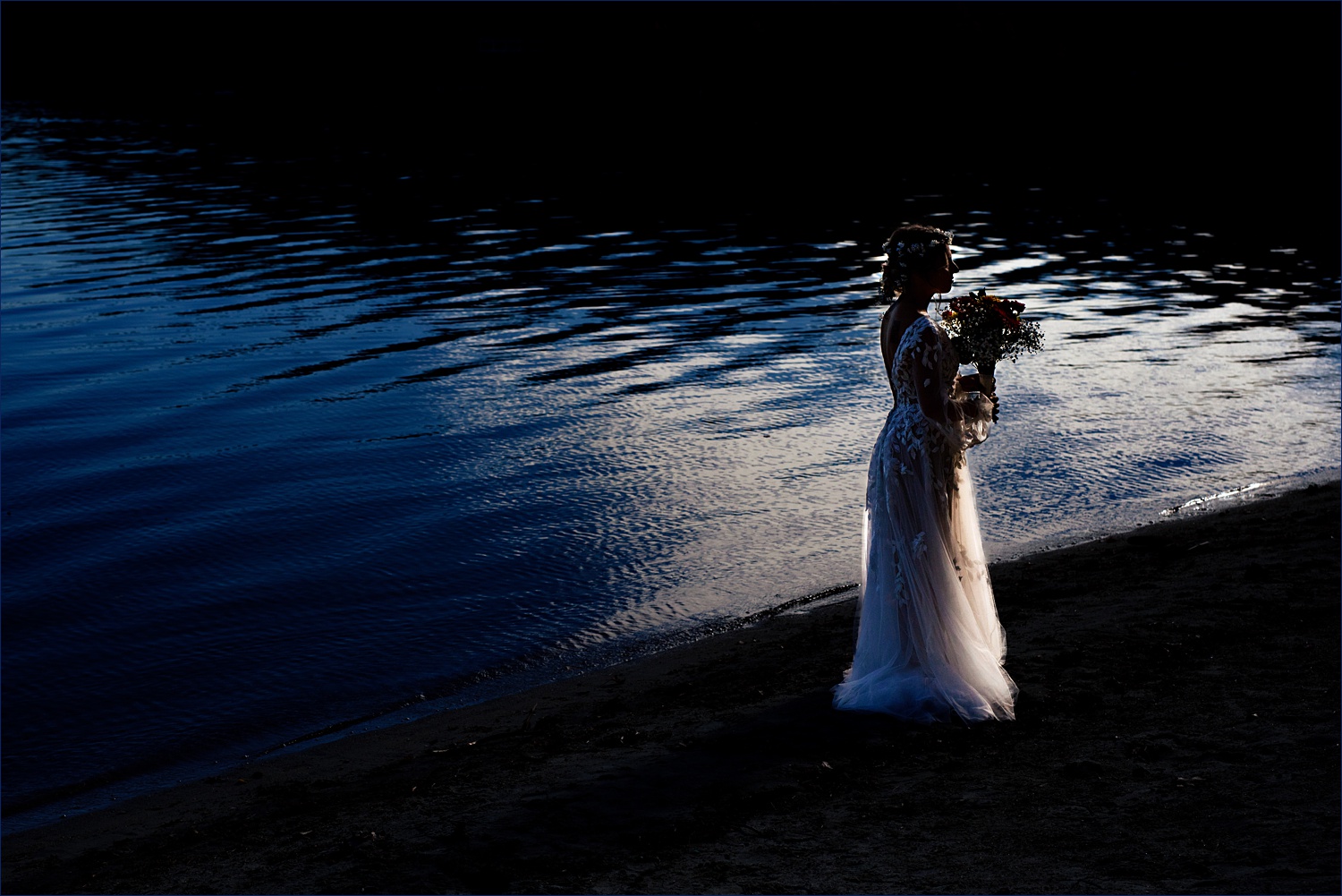 The bride in front of Newfound Lake in New Hampshire