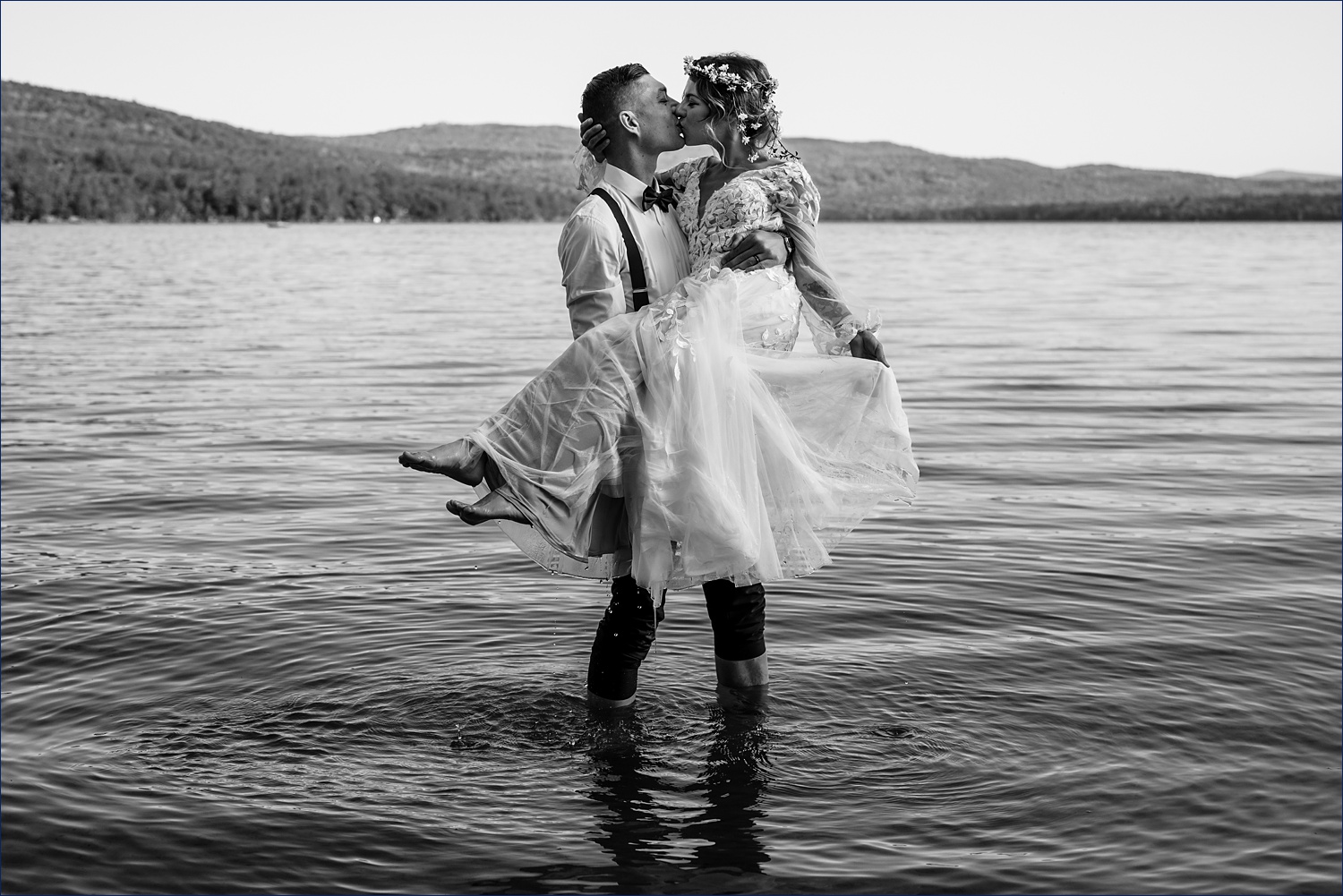 The couple embrace on their NH White Mountain elopement