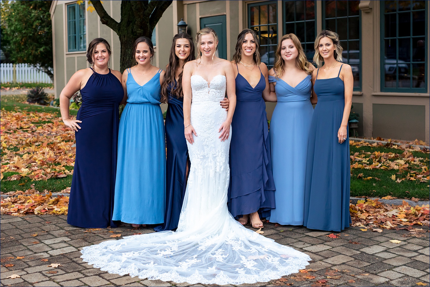 Bride and her bridesmaids outside on the fall wedding in Maine