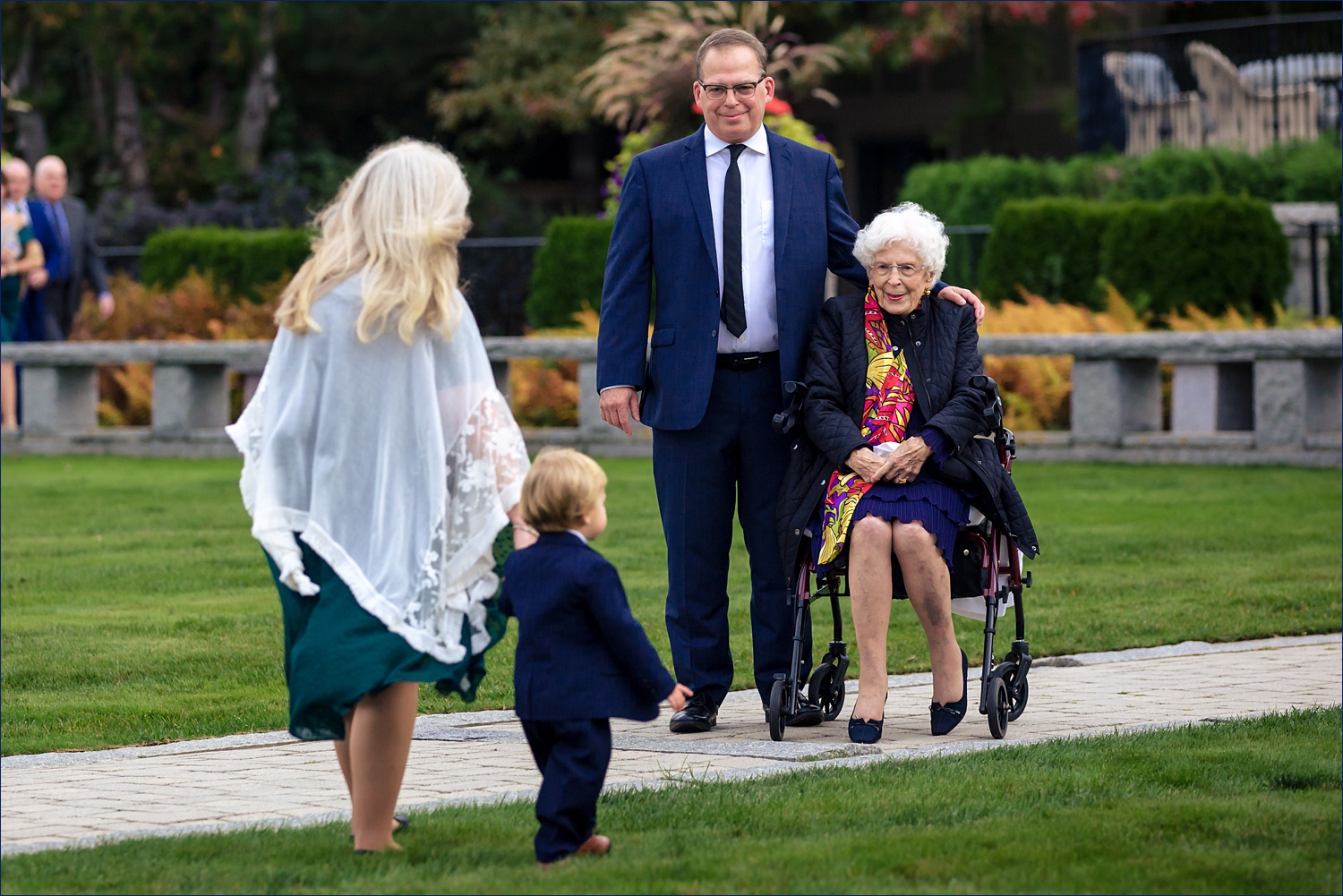 Grandma greets the littlest wedding guest