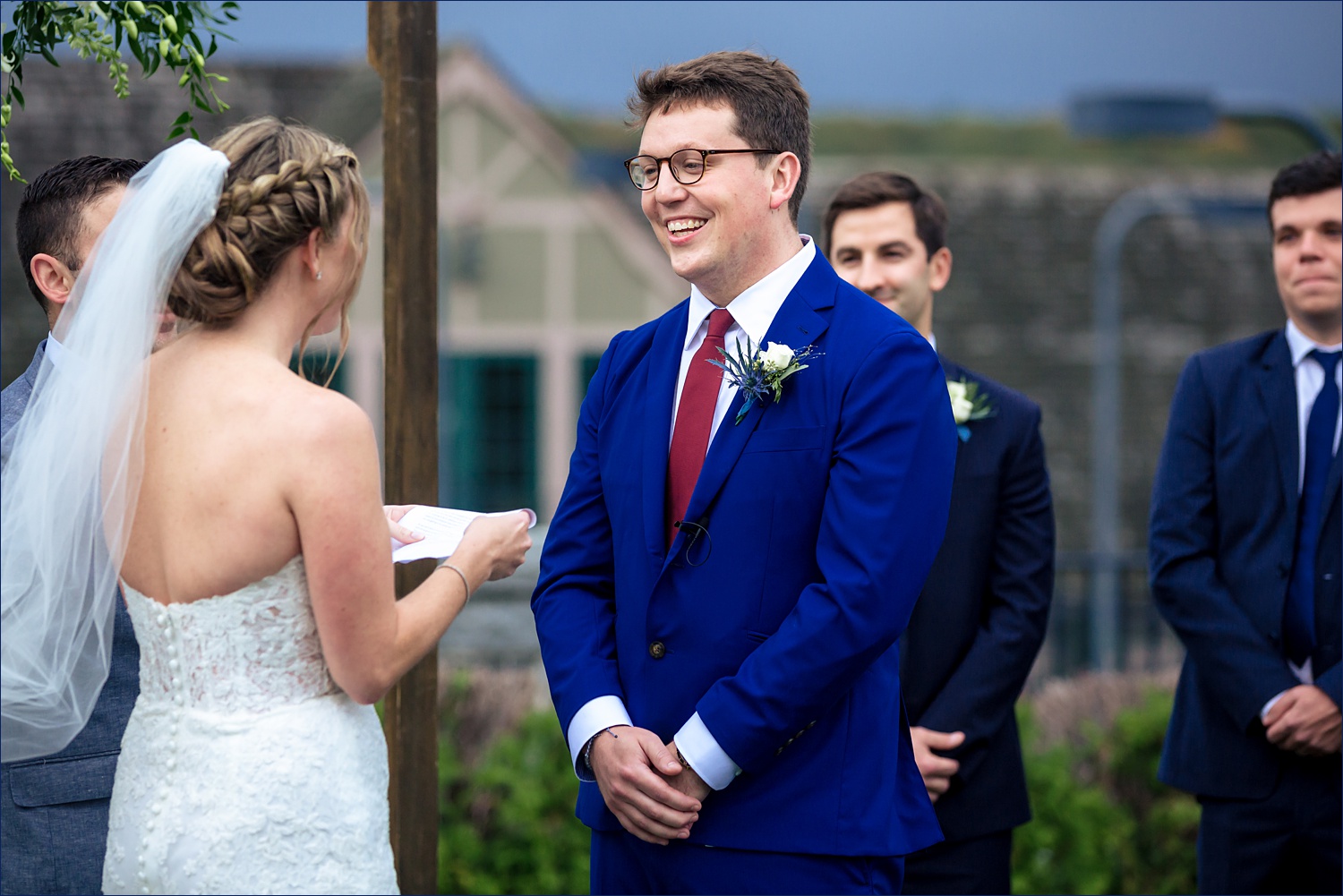Smiling groom during the Maine wedding ceremony