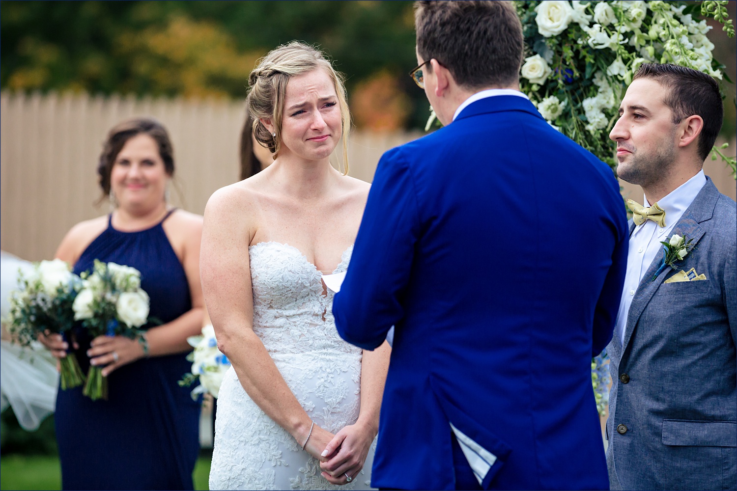 Tearful bride during the outdoor Maine wedding ceremony