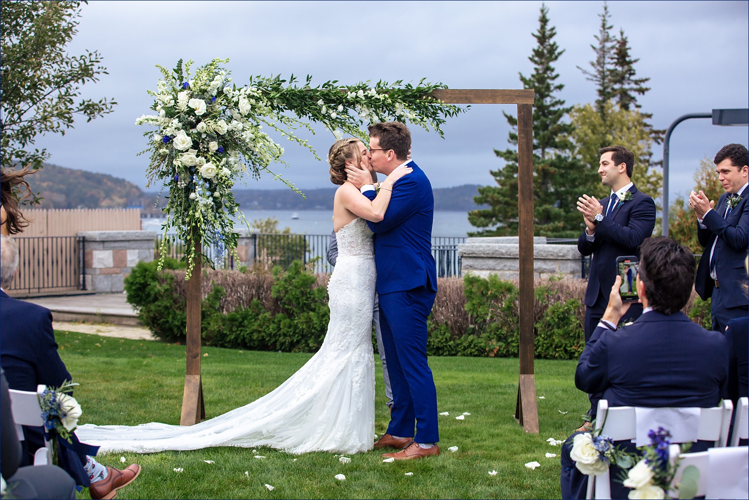 First kiss at their outdoor ceremony at Bar Harbor Club in Maine